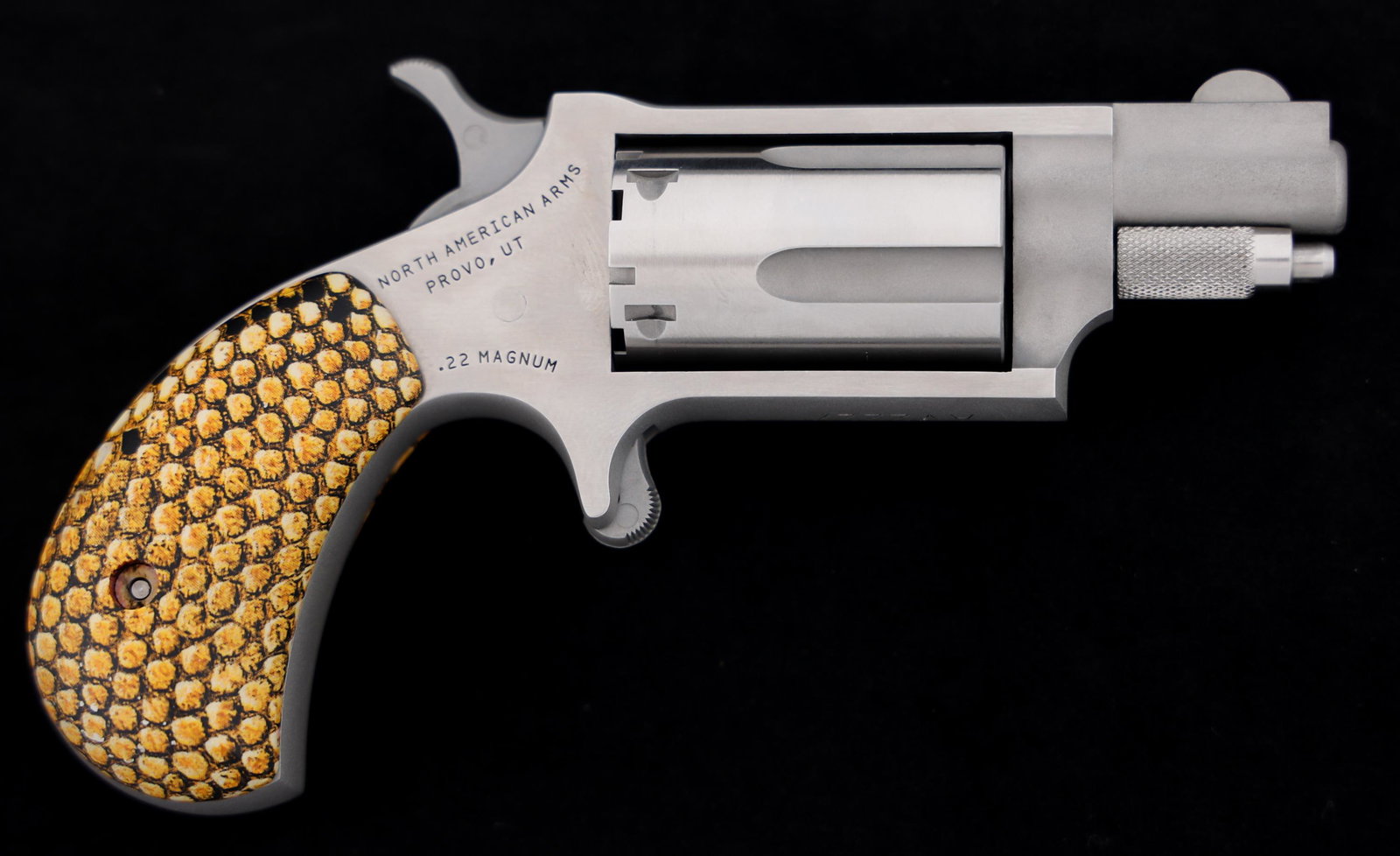 NORTH AMERICAN ARMS .22 MAG CAL MINI SA REVOLVER: NORTH AMERICAN ARMS .22 MAG CAL MINI SA REVOLVER North American Arms Model NAA-22MSGST-SG .22 Magnum caliber mini single action revolver. Stainless finish. Laser engraved snake on left side of frame. 