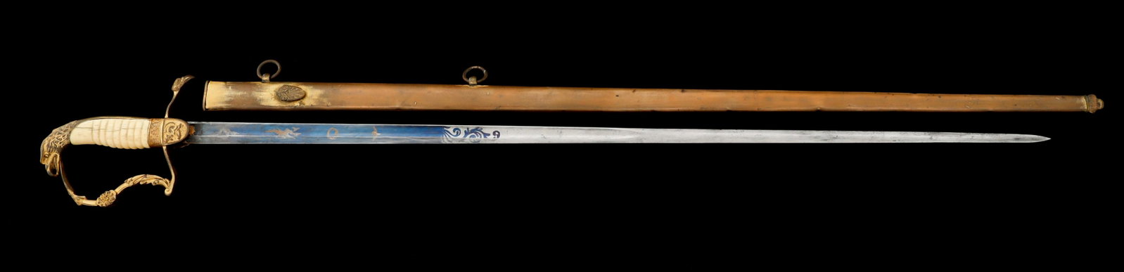 EARLY 19th C. WEST POINT CADET EAGLE HEAD SWORD: EARLY 19th C. WEST POINT CADET EAGLE HEAD SWORD Early 19th Century West Point Cadet Eagle Head Sword. Straight, half blued blade with gold washed patriotic patterns. No visible maker marks. Gilded and