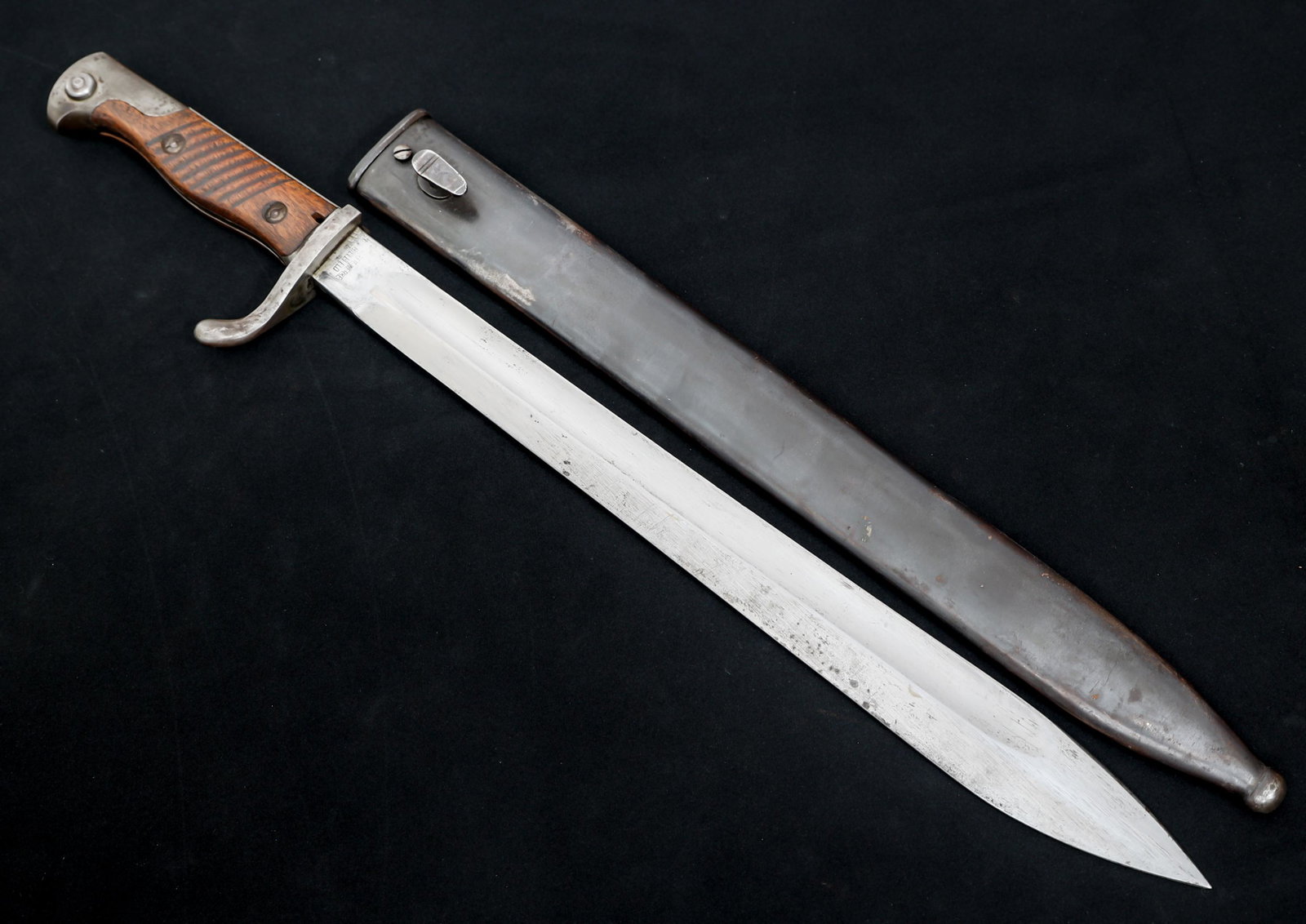 GERMAN M1898/05 BUTCHER BAYONET By HENCKELS: GERMAN M1898/05 BUTCHER BAYONET By HENCKELS German M1898/05 Butcher Bayonet. Single edged, bright blade with fuller. Inspection marks on spine. Maker mark / logo "J A Henckels KG" on one side of ricas