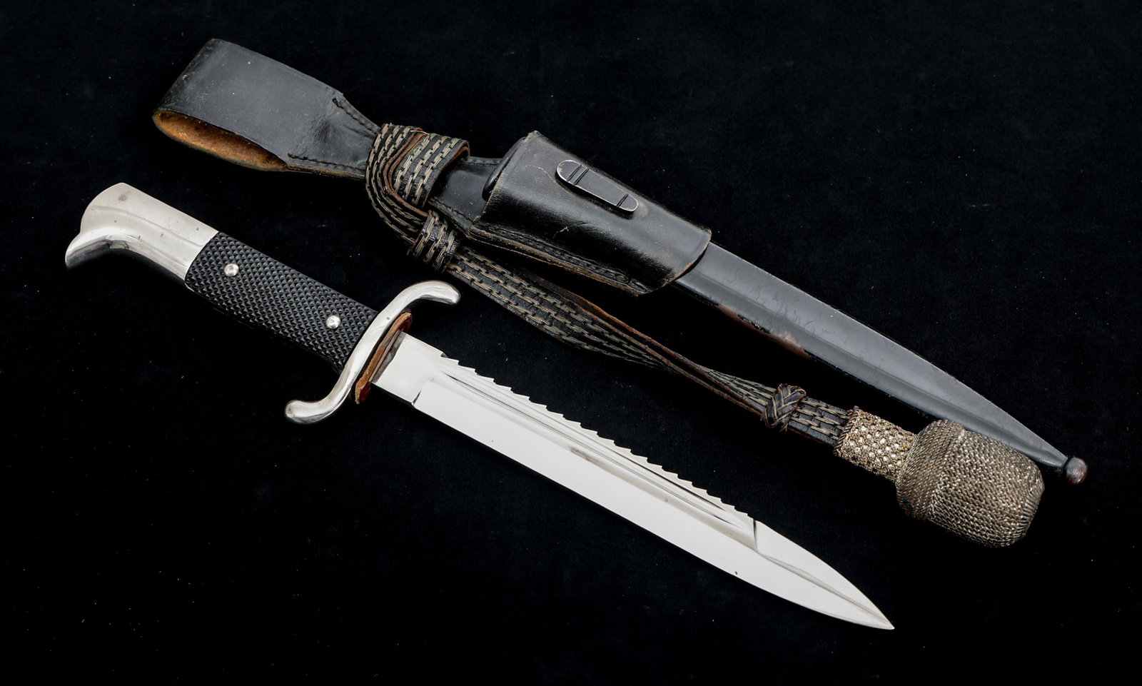 WWII GERMAN FIREMAN SAWBACK K98 DRESS BAYONET: WWII GERMAN FIREMAN SAWBACK K98 DRESS BAYONET WWII German K98 Fireman's Sawback Dress Bayonet with Black Painted Steel Scabbard. Spear point, bright, straight blade with fuller. No maker marks visible