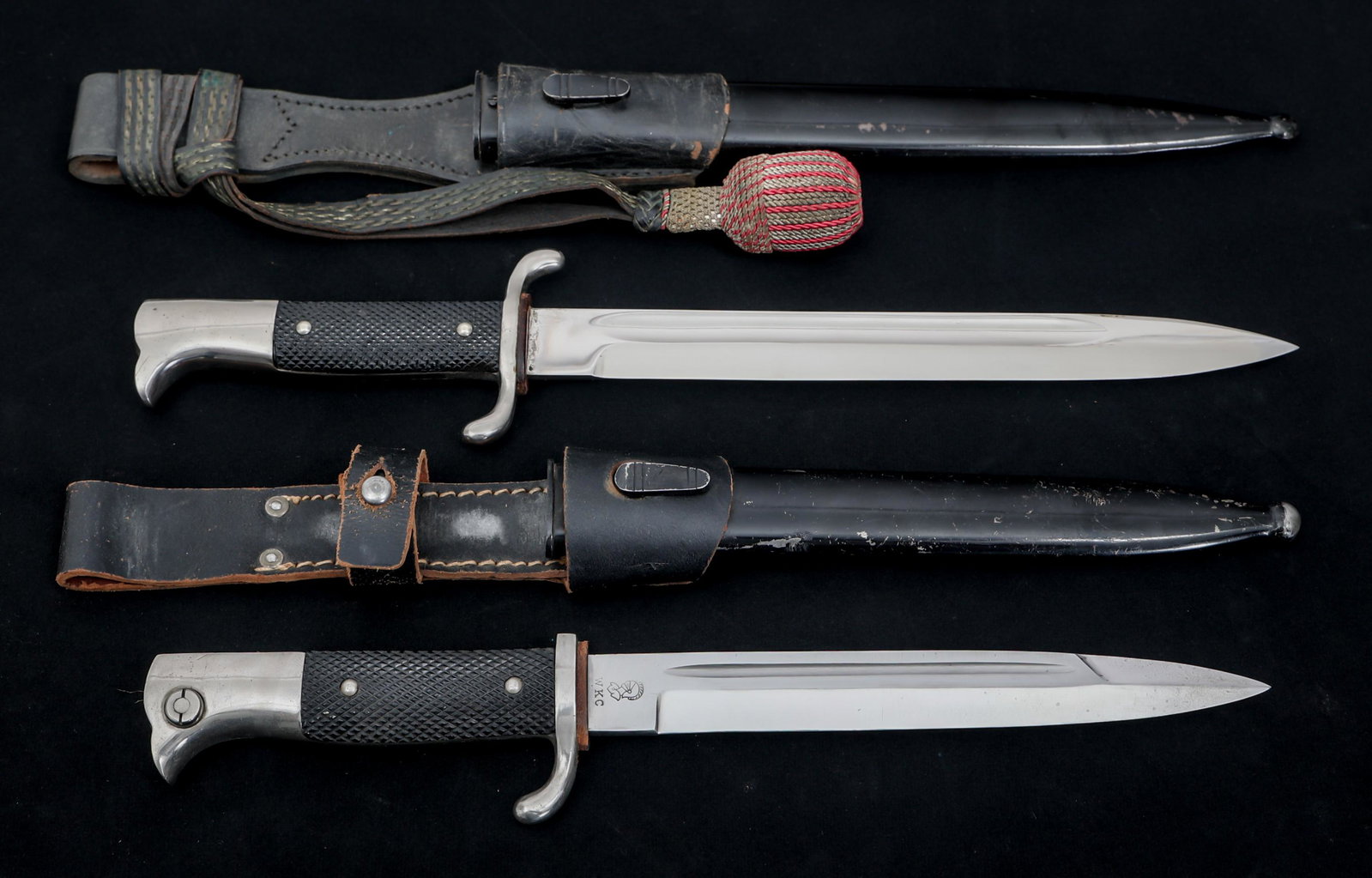 WWII GERMAN K98 DRESS & FIREMAN DRESS BAYONETS: WWII GERMAN K98 DRESS & FIREMAN DRESS BAYONETS Lot of 2 German K98 Dress and Fireman Dress Bayonets. (1) Fireman K98 Dress Bayonet. Bright, straight blade with fuller. Maker mark / logo of "Emil Voos"