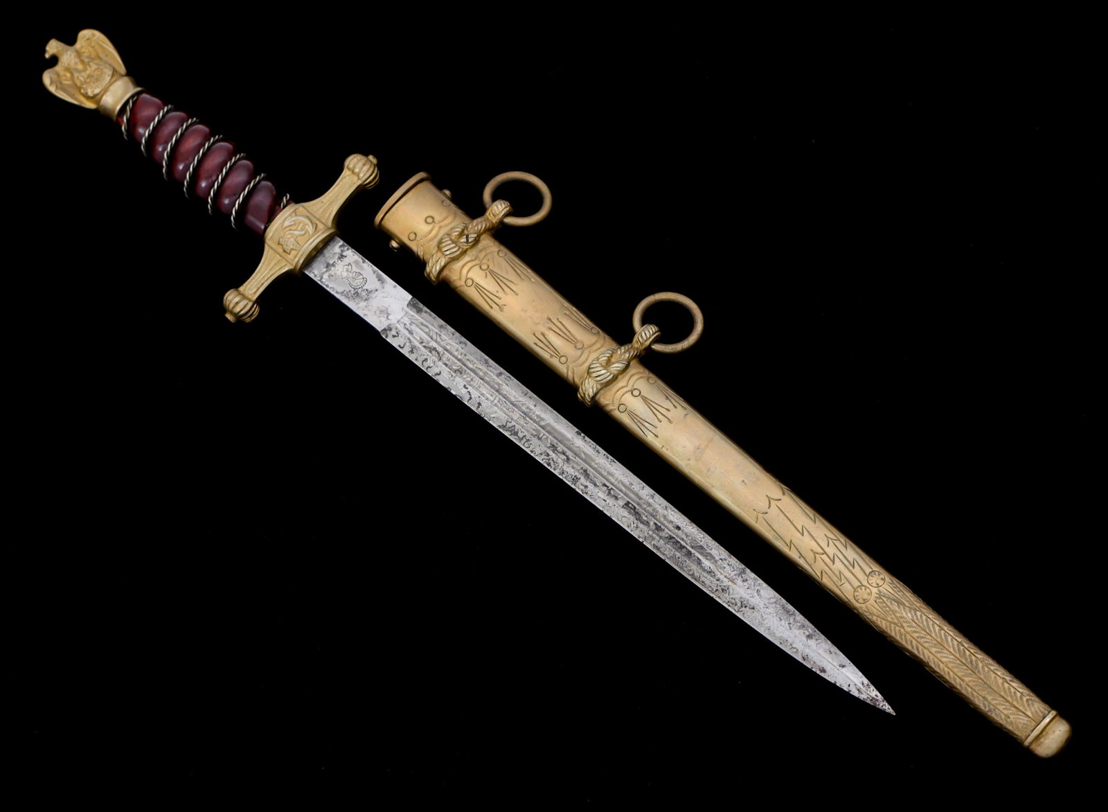WWII GERMAN 2nd MODEL KRIEGSMARINE OFFICER DAGGER: WWII GERMAN 2nd MODEL KRIEGSMARINE OFFICER DAGGER WWII German Kriegsmarine 2nd Model Officer Dagger. Needle point, straight, floral and anchor acid etched blade with dual fuller. Maker mark "WK&C" Kni