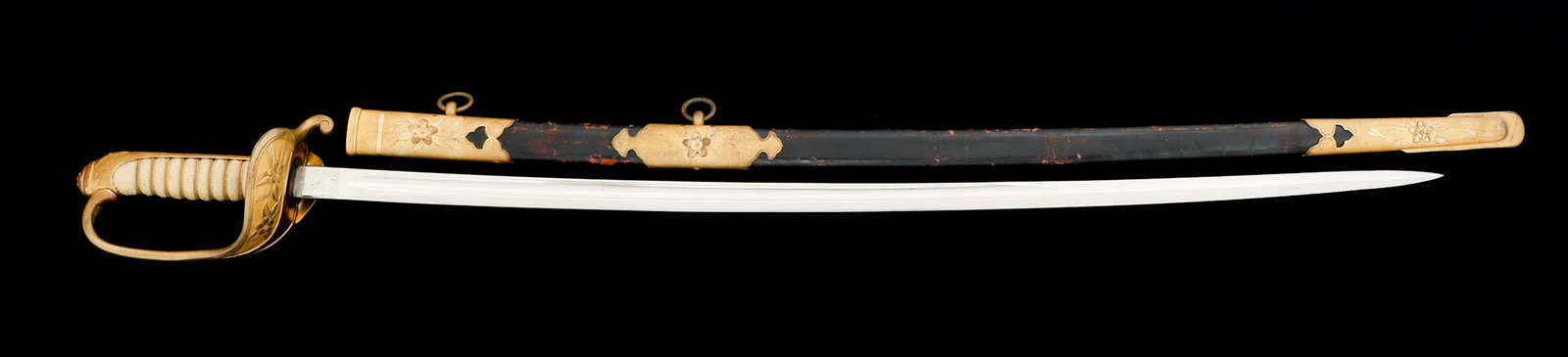 JAPANESE OFFICER 1883 KYU-GUNTO NAVAL SWORD: JAPANESE OFFICER 1883 KYU-GUNTO NAVAL SWORD Imperial Japanese Officer 1883 Series Kyu-Gunto Naval Sword. Single edged, slightly curved, bright blade with fuller along the spine. Leather buffer pad und