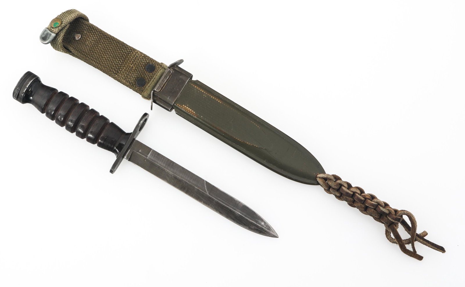 WWII US ARMY M4 BAYONET & SCABBARD BY IMPERIAL: WWII US ARMY M4 BAYONET & SCABBARD BY IMPERIAL WWII US Army M4 bayonet for M1 carbine. Parkerized blade, stacked leather handle. Stamped "U.S M4 Imperial" under the guard. USM8 scabbard. Blade Length: