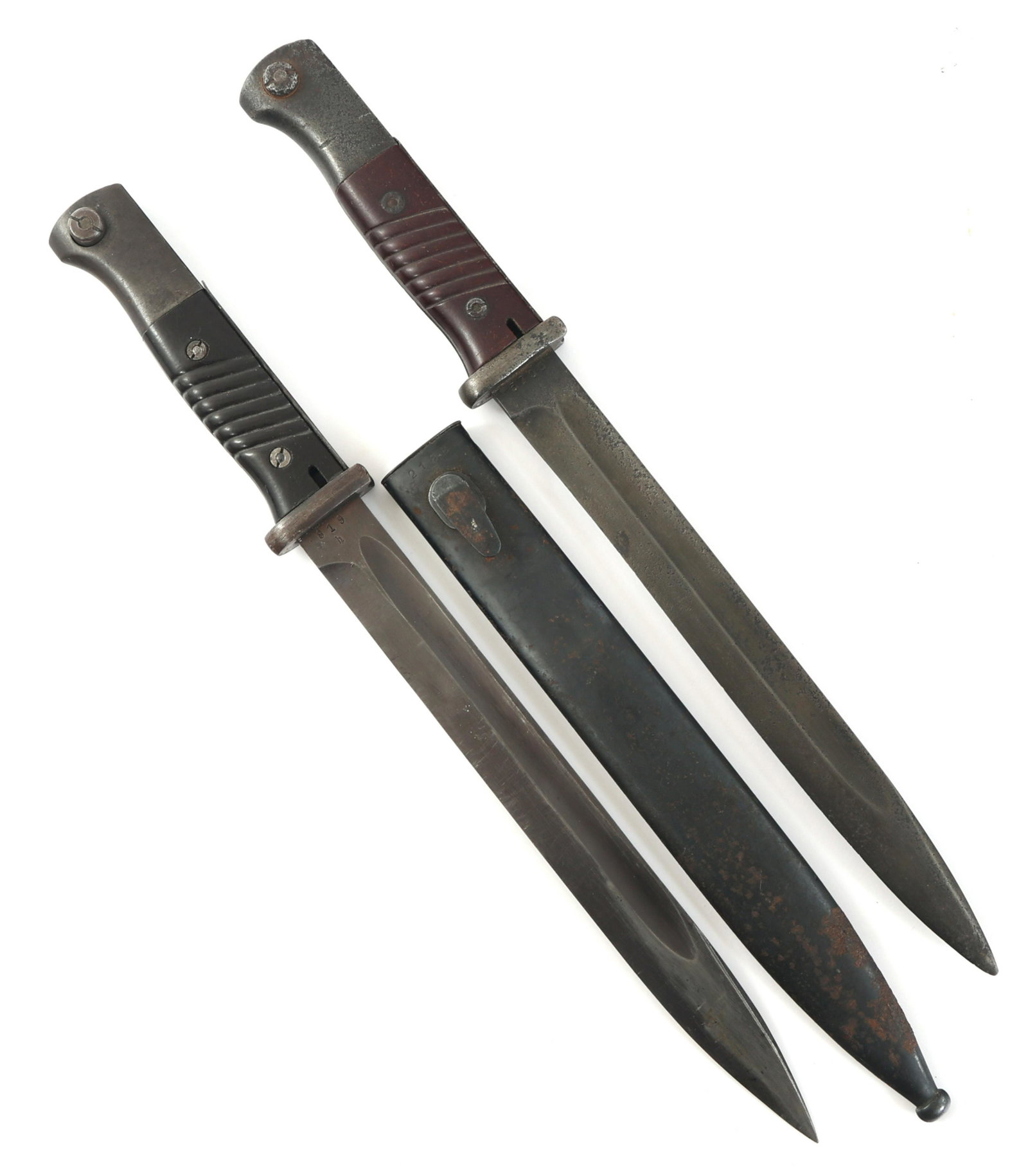 WWII GERMAN K98 COMBAT BAYONET LOT OF 2: WWII GERMAN K98 COMBAT BAYONET LOT OF 2 Lot of 2 WWII German K98 Combat Bayonets. (1) K98 Bayonet (mismatched numbers). Singled edged, blued blade with fuller. Maker mark of WKC on one side of the ric