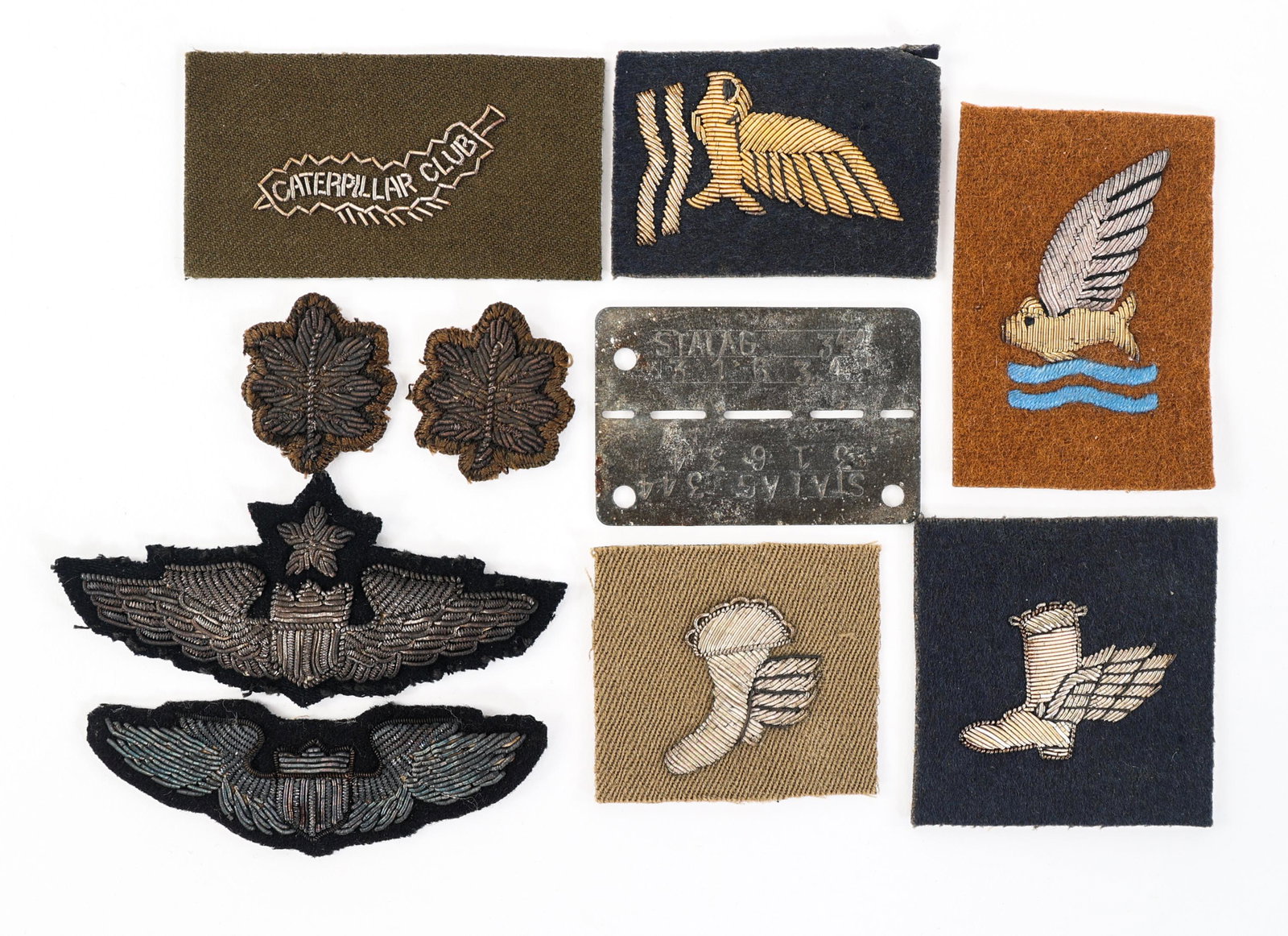 WWII AAF & RAF WINGED BOOTS - CATERPILLAR & WINGS: WWII AAF & RAF WINGED BOOTS - CATERPILLAR & WINGS WWII US AAF & RAF Bail Out & Wings Patches lot. (1) AAF Caterpillar patch, gold bullion thread. (2) AAF Goldfish club award patch variation. Bullion e