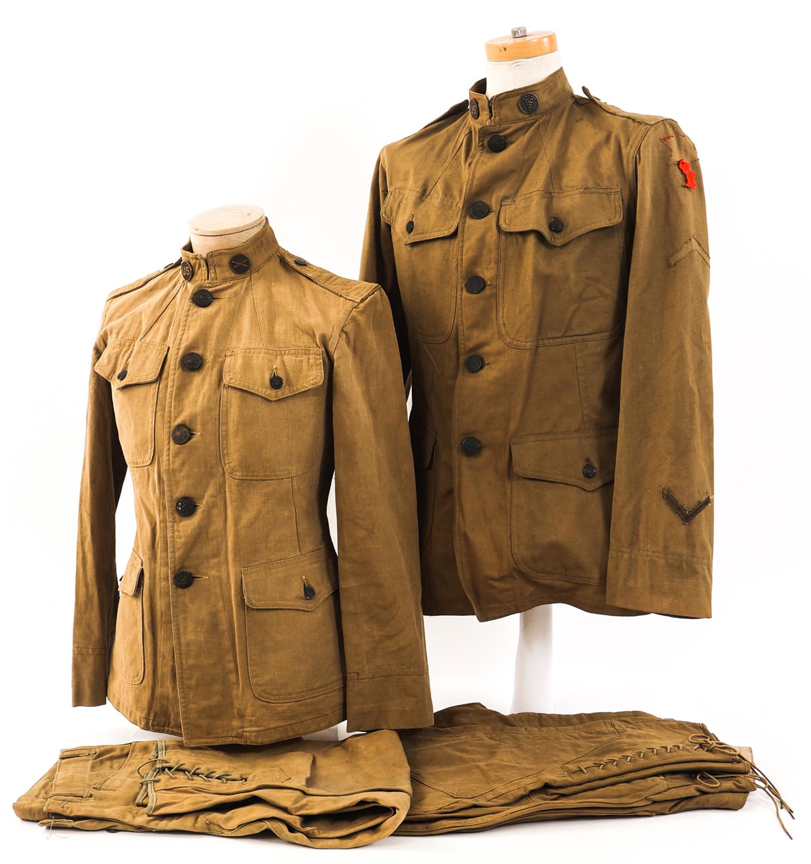 WWI US ARMY M1912 ENLISTED KHAKI SUMMER UNIFORMS: WWI US ARMY M1912 ENLISTED KHAKI SUMMER UNIFORMS Lot of 2 WWI US Army M1912 Enlisted Uniforms. Includes khaki cotton tunics with collar insignia and breeches. Size: small