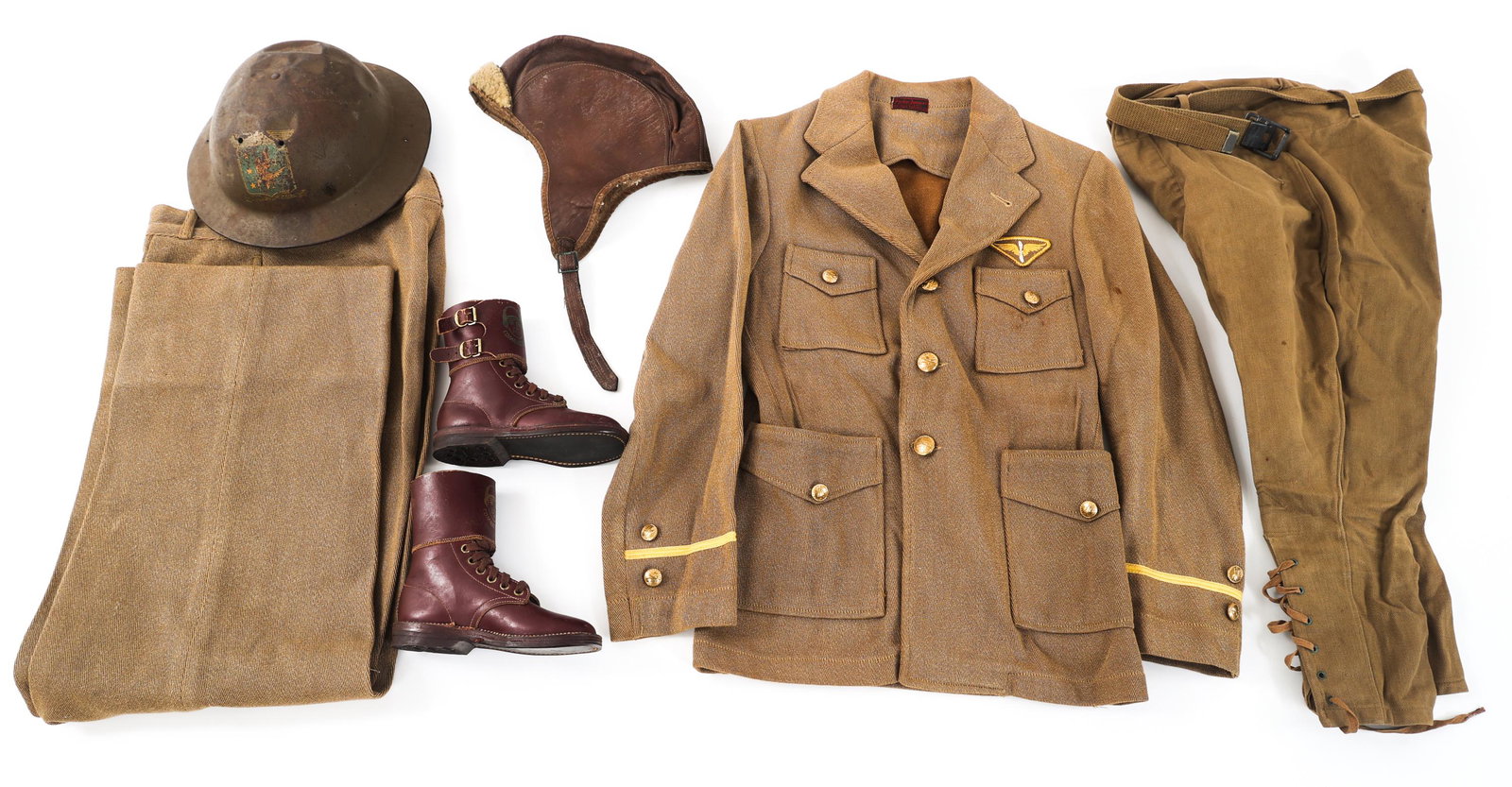 WWI - WWII US ARMY CHILD UNIFORM LOT: WWI - WWII US ARMY CHILD UNIFORM LOT WWI - WWII US Army Child Uniform Lot. Includes: Tunic, breeches, straight pants, flight helmet, M1917 doughboy type helmet, double buckle combat boots. Size: 6 - 8