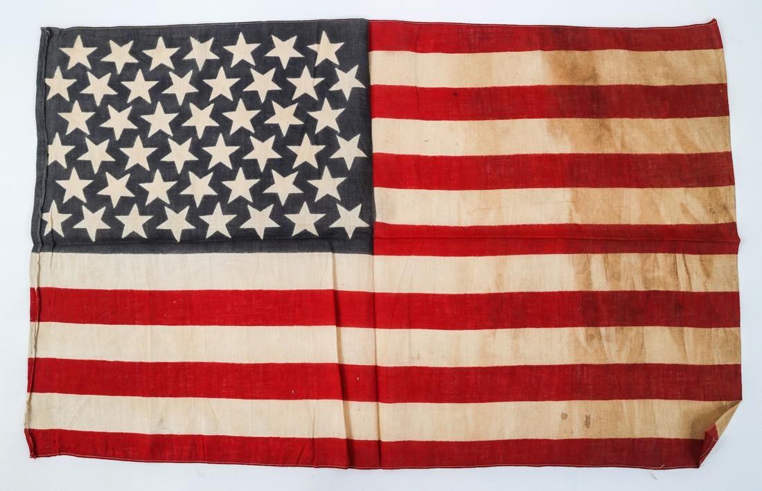 SPAN-AM WAR ERA 45 STAR US FLAG: SPAN-AM WAR ERA 45 STAR US FLAG Span-Am Era 45 Star US Flag. One-piece cloth, printed red and blue on white construction. No visible marks. Size: 17 1/2" x 28 12"