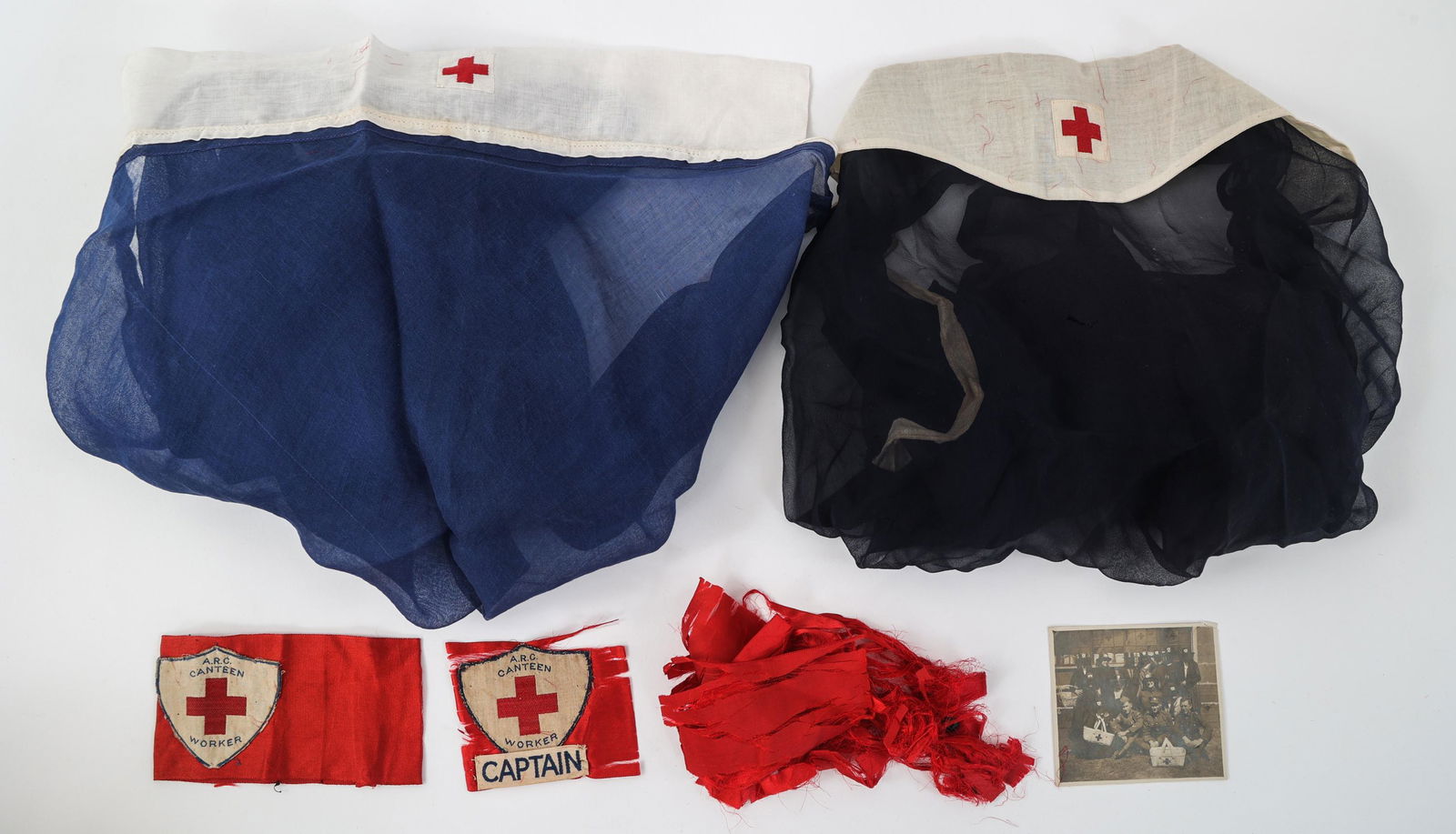 WWI AMERICAN RED CROSS ARMBAND AND HEADSCARF LOT: WWI AMERICAN RED CROSS ARMBAND AND HEADSCARF LOT Lot of 5 WWI American Red Cross Armbands, Head scarves and Photo. (2) WWI American Red Cross nurse head veil cap scarf. (2) A.R.C. Canteen Worker armba