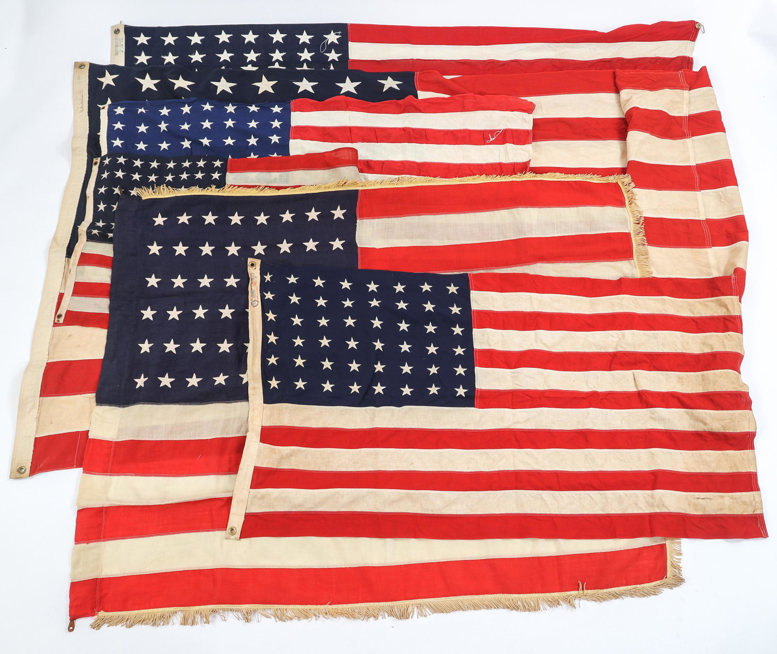 WWII 48-STAR AMERICAN FLAGS LOT OF 6: WWII 48-STAR AMERICAN FLAGS LOT OF 6 WWII 48-Star American flags, Lot of 6. Various manufacturing styles including: printed, embroidered and sewn stars on cotton. Stripes are multiple piece constructi