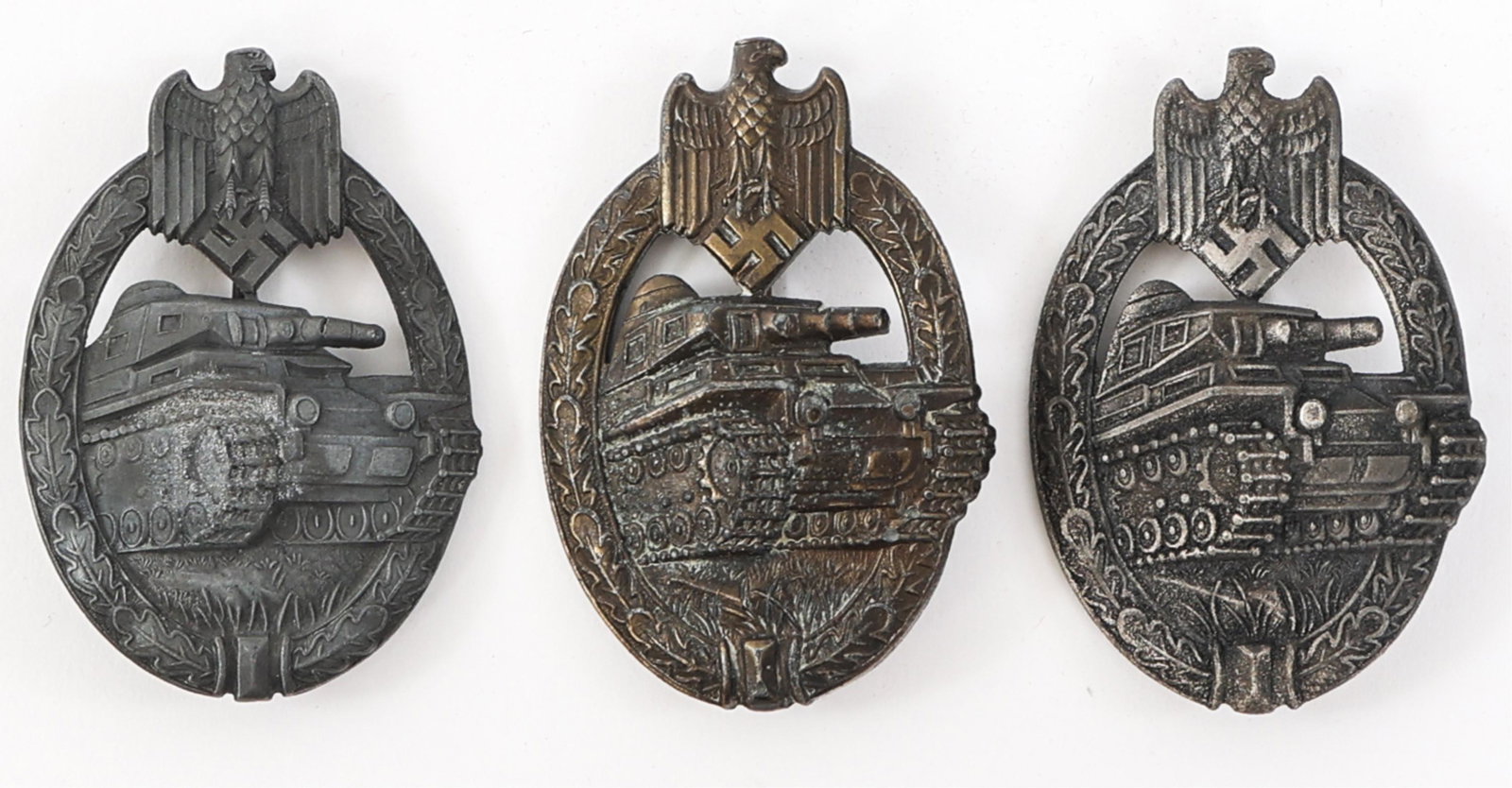 WWII GERMAN ARMY PANZER BADGE LOT OF 3: WWII GERMAN ARMY PANZER BADGE LOT OF 3 Lot of 3 WWII German Panzer Badges. (2) WWII German Army Panzer badges in Silver Grade. One maker marked. (1) WWII German Army Panzer Bade in Bronze Grade. Maker