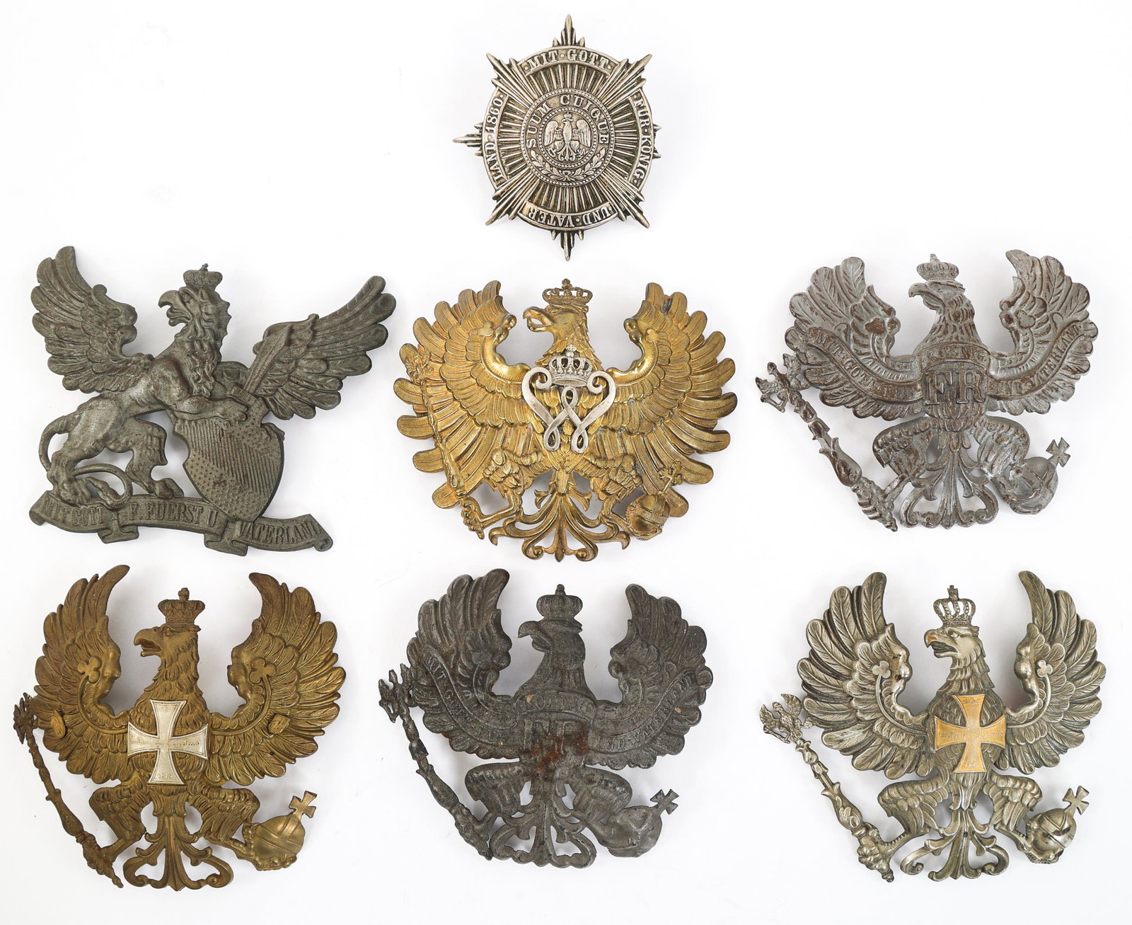 WWI IMPERIAL GERMAN PICKELHAUBE FRONT PLATE LOT: WWI IMPERIAL GERMAN PICKELHAUBE FRONT PLATE LOT Lot of 7 WWI Imperial German Pickelhaube Front Plates. Assorted regiments including Reserve, Baden Infantry and Prussian Guards.