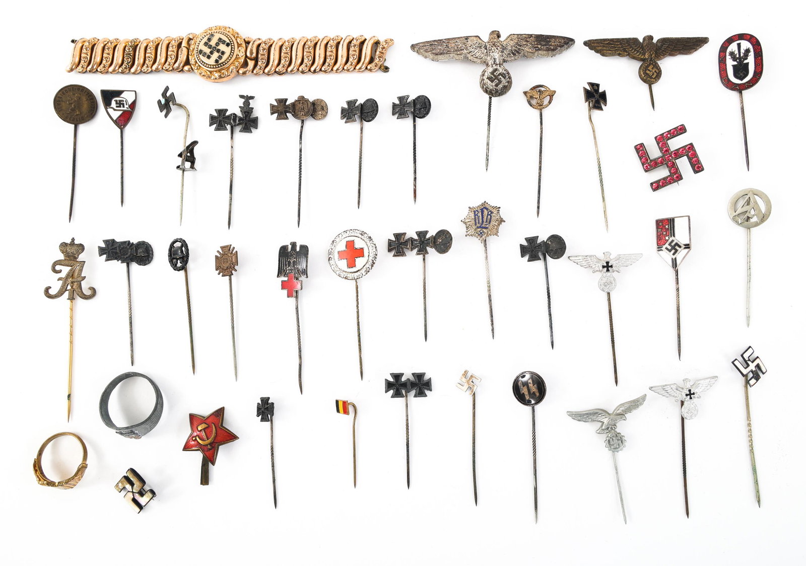 WWI - WWII GERMAN TIE PIN - RING & BRACELET LOT: WWI - WWII GERMAN TIE PIN - RING & BRACELET LOT WWI - WWII German Tie Pin - Ring & Bracelet Lot. Includes Luftwaffe; Red Cross; Army; Wound badge and other tie pins; theater made aluminum and brass ri
