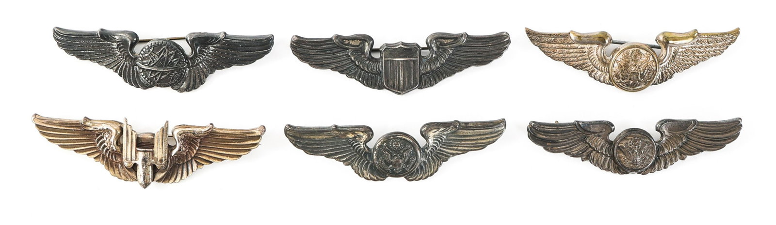 WWII AAF PILOT - AIRCREW - GUNNER & NAVIGATOR WING: WWII AAF PILOT - AIRCREW - GUNNER & NAVIGATOR WING Lot of 6 WWII US Army Air Force Qualification Wings. (1) WWII AAF Navigator wings. Sterling, pin-back. Size: 3". (1) WWII AAF Pilot wings. Sterling, 
