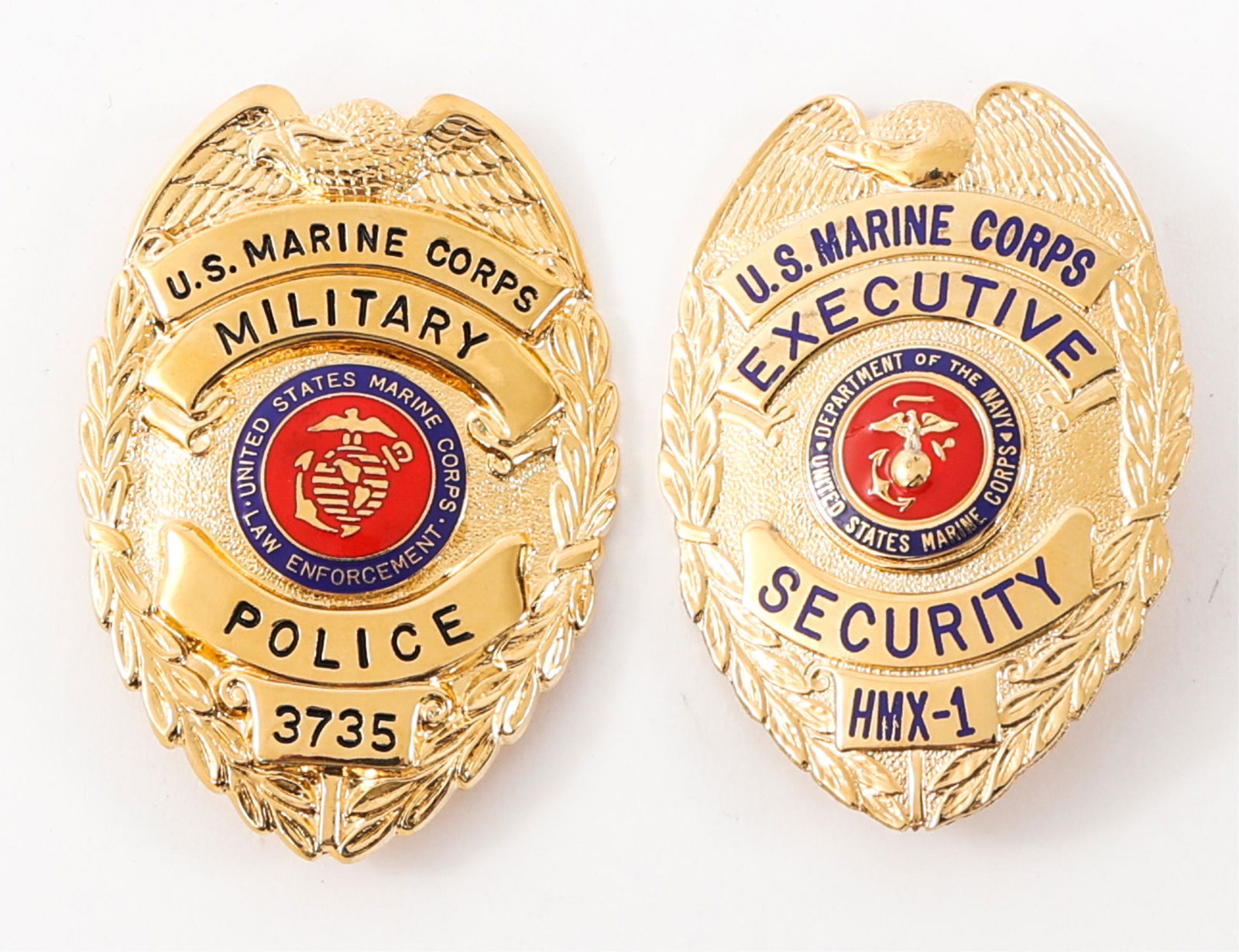 USMC MILITARY POLICE & HMX-1 SECURITY BADGES: USMC MILITARY POLICE & HMX-1 SECURITY BADGES Lot of 2 US Marine Corps Badges. (1) US Marine Corps, Military Police gilded badge # 3735. Maker marked "Blackinton". Size: 3" x 2". (1) US Marine Corps, H