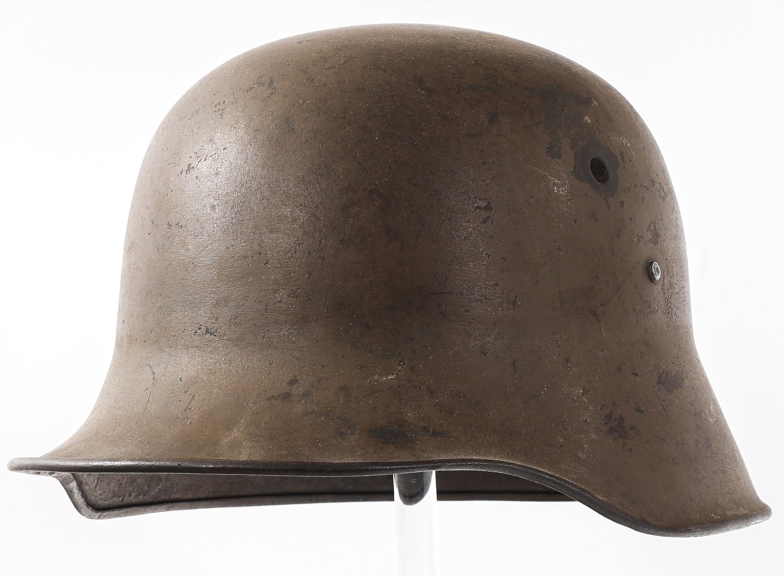 WWI AUSTRO - HUNGARIAN M1917 COMBAT HELMET SHELL: WWI AUSTRO - HUNGARIAN M1917 COMBAT HELMET SHELL WWI Austro - Hungarian M1917 Combat Helmet Shell. Khaki / brown painted outer shell. Rolled rim. Manufacturer ink stamp (illegible), "64" and "L" stamp