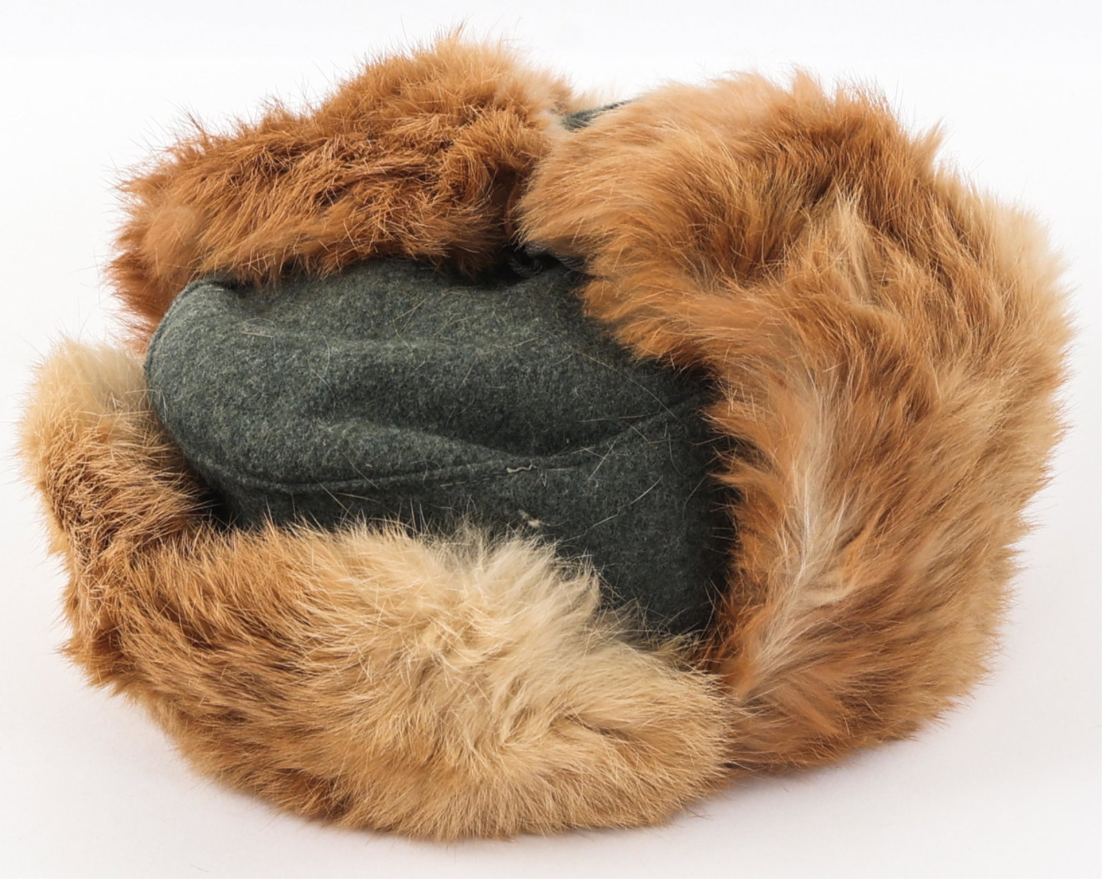 WWII GERMAN COLD WEATHER FUR LINED CAP: WWII GERMAN COLD WEATHER FUR LINED CAP WWII German Cold Weather Fur Lined Hat. Most likely rabbit fur. Fold down ear flaps and front visor with German Army Eagle insignia. Feldgrau wool outer material