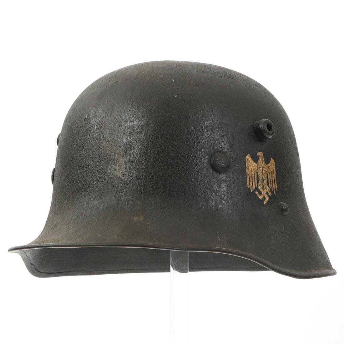 TRANSITIONAL SINGLE-DECAL AUSTRIAN M1917 HELMET: TRANSITIONAL SINGLE-DECAL AUSTRIAN M1917 HELMET Pre-WWII Austrian M1917 Steel Combat Helmet. Transitional pattern, requisitioned by the German Heer and fitted with the M1931 liner system. Period dark 