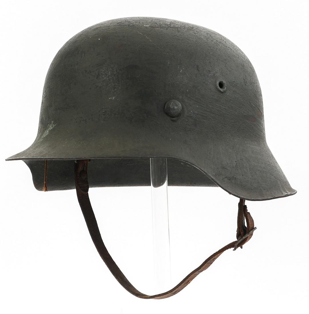 WWII GERMAN HEER M42 COMBAT HELMET: WWII GERMAN HEER M42 COMBAT HELMET WWII German Heer M42 Combat Helmet. No decal. Period "rough" style re-paint with Heer light gray / green color. Maker marked "Q66" (F.W. Quist G.m.b.H., Esslingen) s