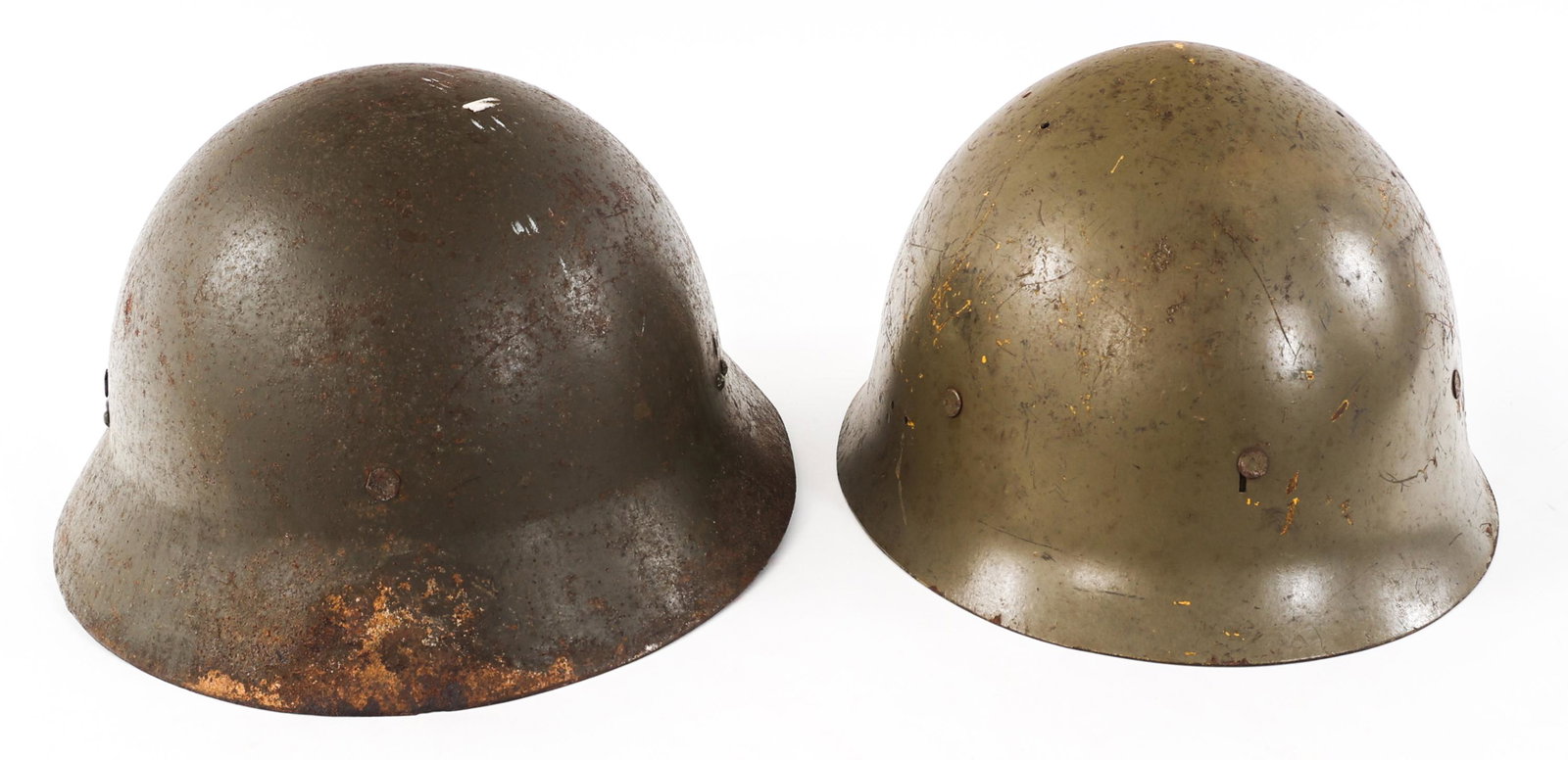 WWII & POST WAR IMPERIAL JAPANESE COMBAT HELMETS: WWII & POST WAR IMPERIAL JAPANESE COMBAT HELMETS Lot of 2 Imperial Japanese Helmets. (1) WWII Imperial Japanese Civil defense Helmet Shell. (1) Post WWII Japanese M30/32 helmet issued to Thailand Forc