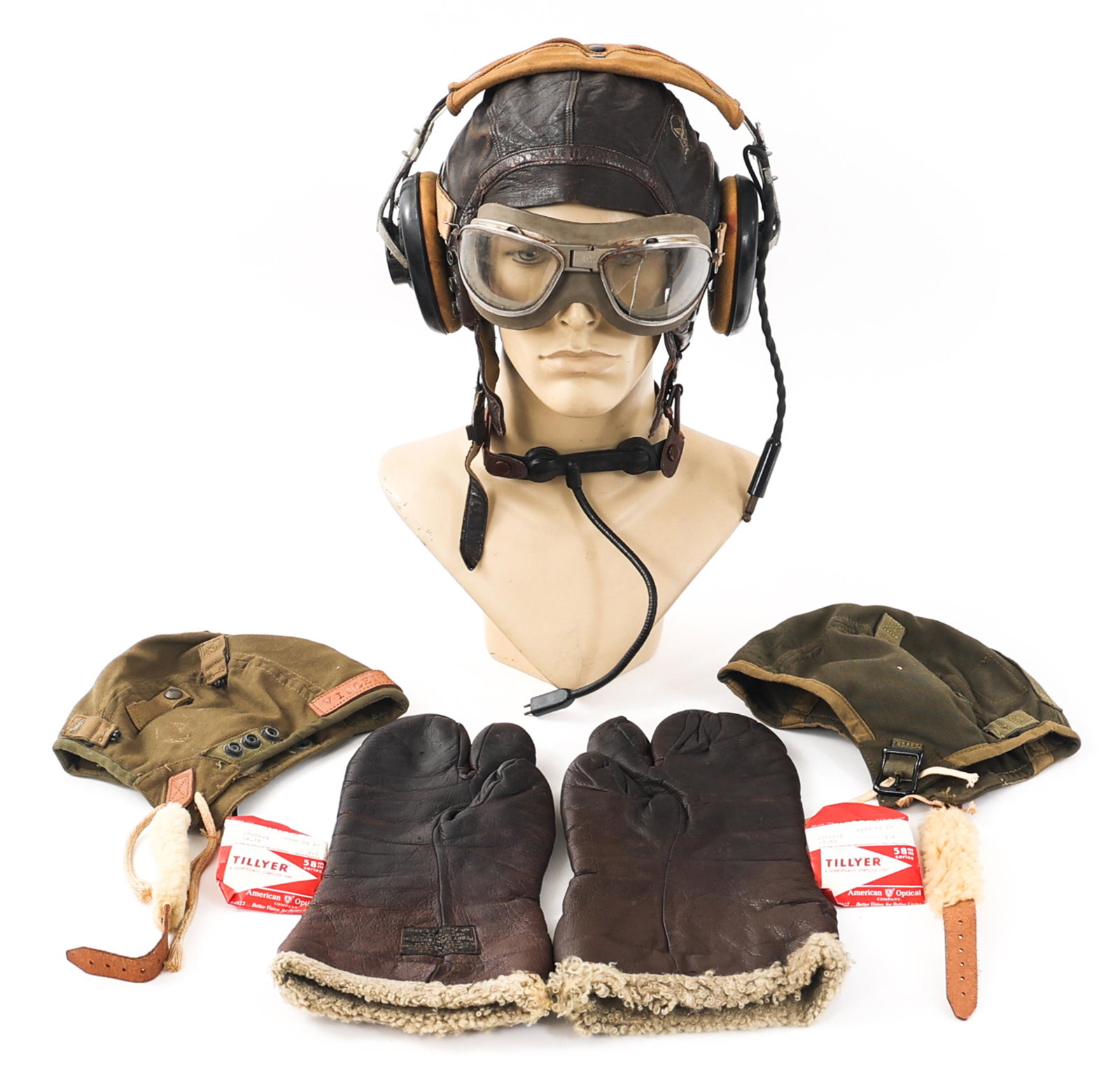 WWII USAAF FLIGHT HELMETS & GEAR: WWII USAAF FLIGHT HELMETS & GEAR WWII USAAF Flight Helmets and Gear. (1) Type A-9 Summer Flying Helmet. OD green cotton material. Mfg. tag present. (1) Type A-11 Leather Flight Helmet. Leather cap. Mf