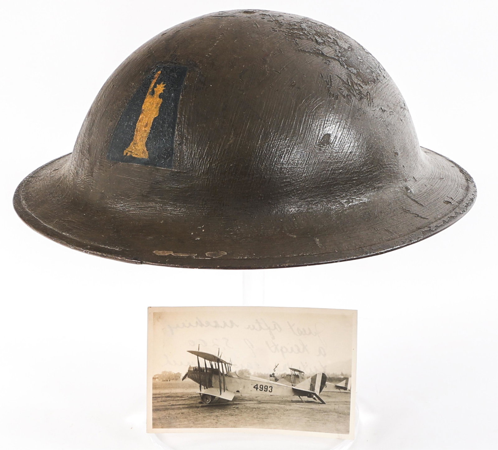 WWI US ARMY AEF 77TH IFANTRY DIV. M1917 HELMET: WWI US ARMY AEF 77TH IFANTRY DIV. M1917 HELMET WWI US Army AEF 77th Infantry Division M1917 "Doughboy" Combat Helmet. Hand painted OD outer shell and 77th ID frontal insignia. Lot number heat stamped 