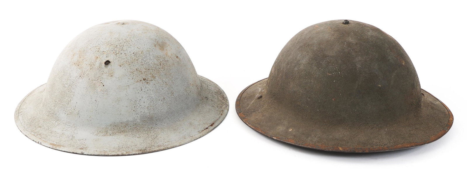 WWI US ARMY AEF M1917 & M1917A1 HELMET LOT OF 2: WWI US ARMY AEF M1917 & M1917A1 HELMET LOT OF 2 Lot of 2 WWI US AEF M1917 Combat Helmets. (1) Shell only. Stamped "ZA57". (1) Complete M1917A1 with shell, liner and chinstrap. Stamped "UC309".