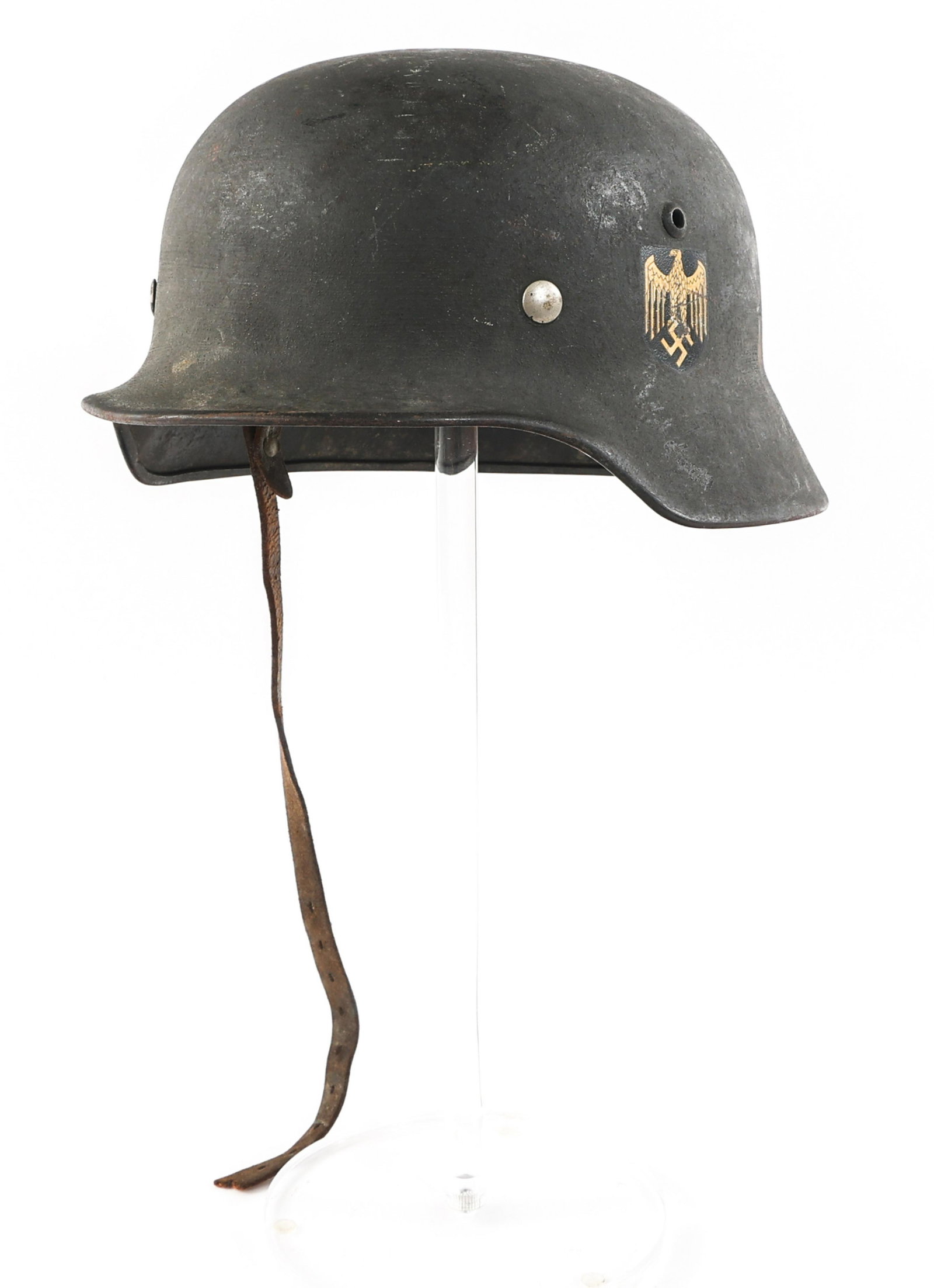 WWII GERMAN KRIEGSMARINE SD M40 HELMET: WWII GERMAN KRIEGSMARINE SD M40 HELMET WWII German Kriegsmarine M40 Single Decal Combat Helmet. Kriegsmarine insignia on side of shell. Stamped "E.F 68" & "677" inside shell near rim. Liner complete, 
