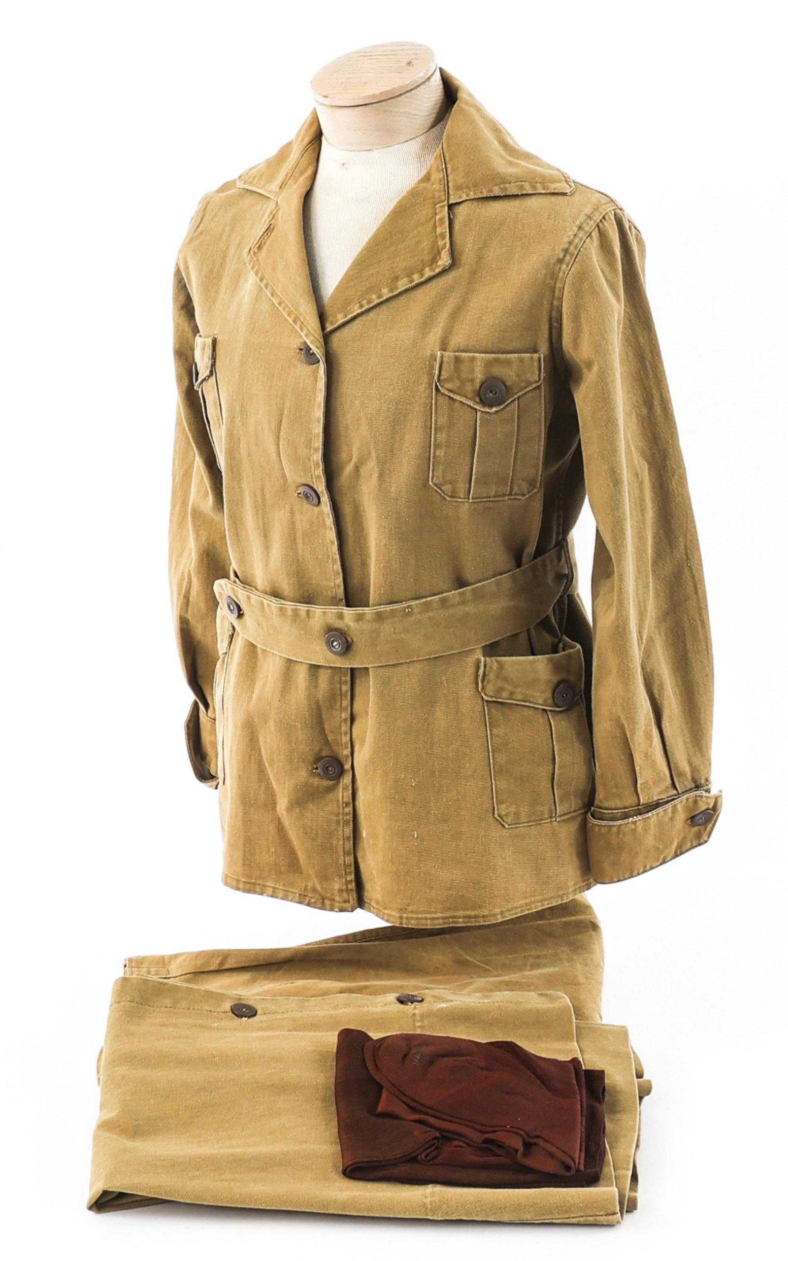 WWI ERA US ARMY NURSE CORPS SERVICE UNIFORM: WWI ERA US ARMY NURSE CORPS SERVICE UNIFORM WWI Era US Army Nurse Corps Service Uniform. Khaki, lightweight tunic with waist belt. No visible marks. Matching skirt and pants. Brown stockings. Size: Sm