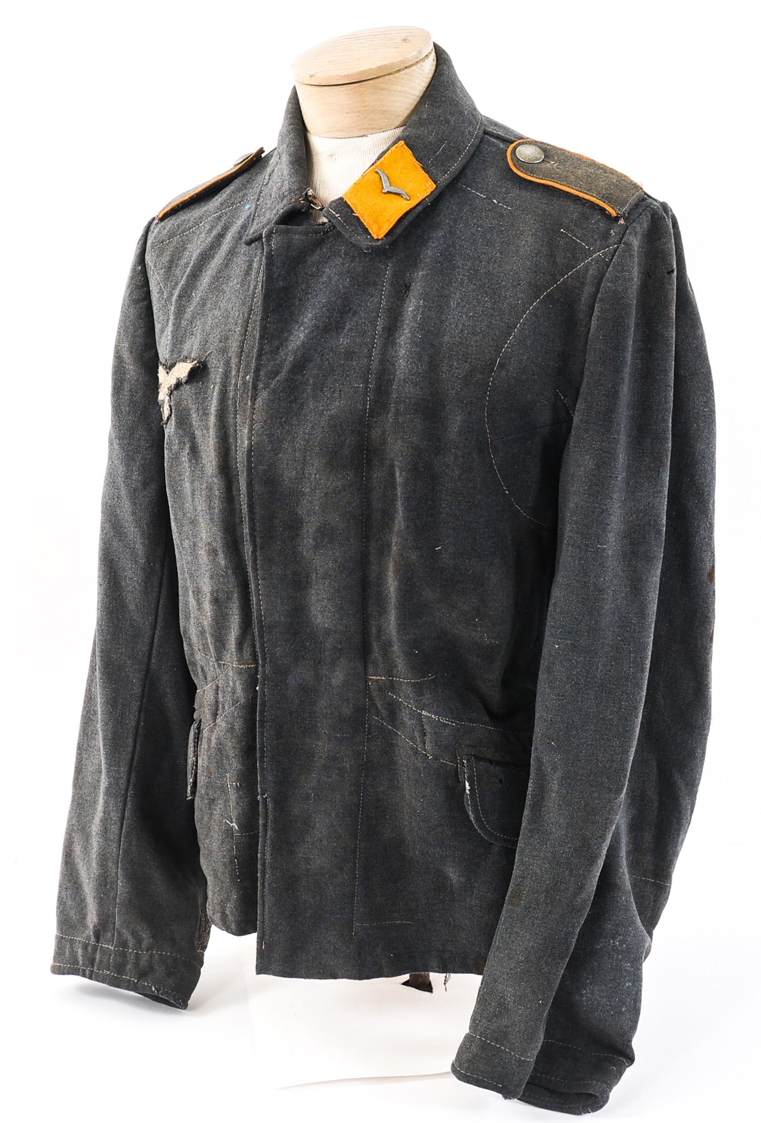 WWII GERMAN LUFTWAFFE FLIEGERBLUSE: WWII GERMAN LUFTWAFFE FLIEGERBLUSE WWII German Luftwaffe Fliegerbluse. Blue / Grey wool and rayon linen construction. Luftwaffe Soldat (Private) collar tabs and embroidered Luftwaffe Eagle breast patc