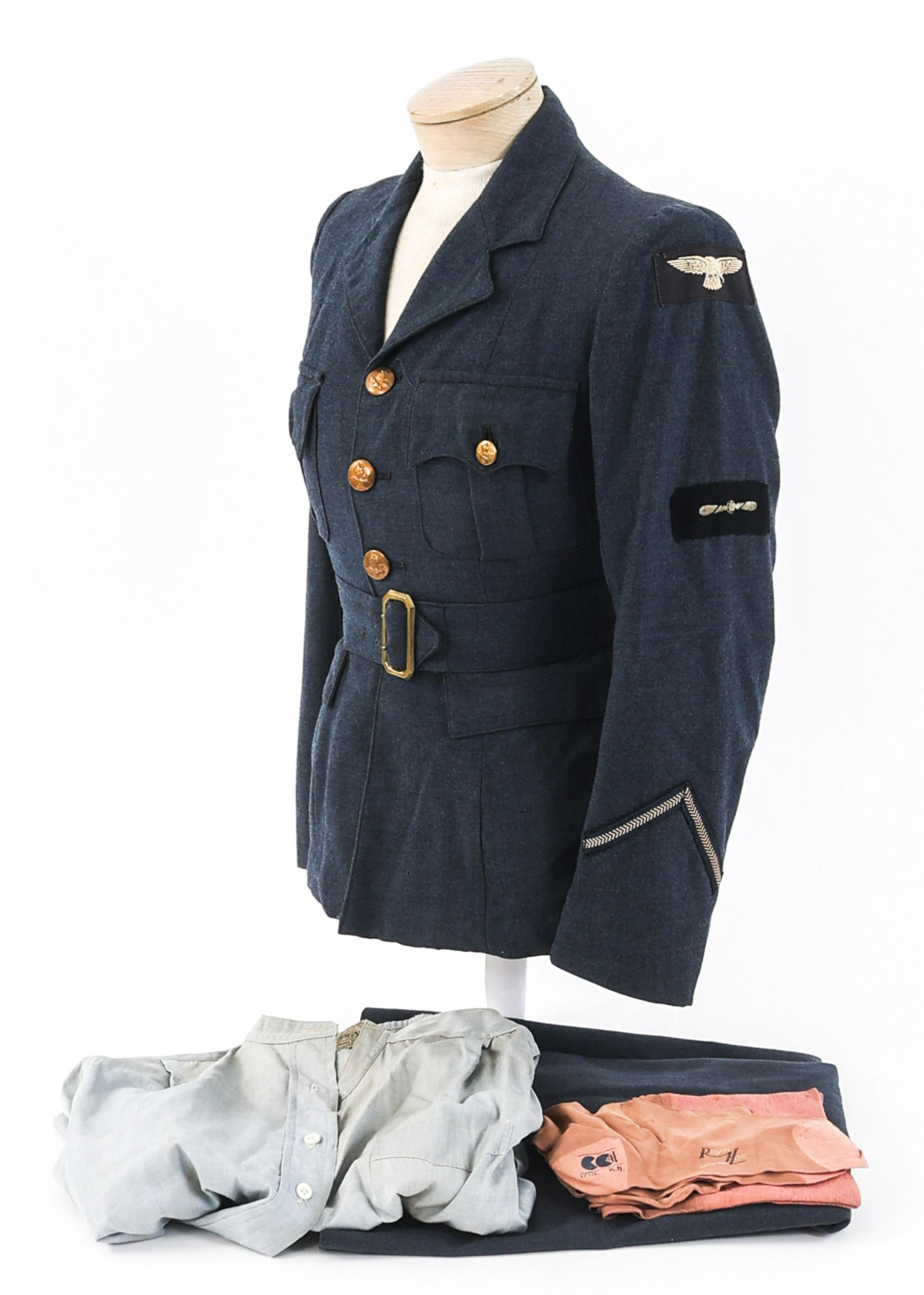 WWII BRITISH WOMEN'S AUXILIARY AIR FORCE UNIFORM: WWII BRITISH WOMEN'S AUXILIARY AIR FORCE UNIFORM WWII British Women's Auxiliary Air Force Enlisted Uniform. Dark blue, fine wool tunic with WAAF wing patches, Wireless Operator and Lead Aircraftwoman