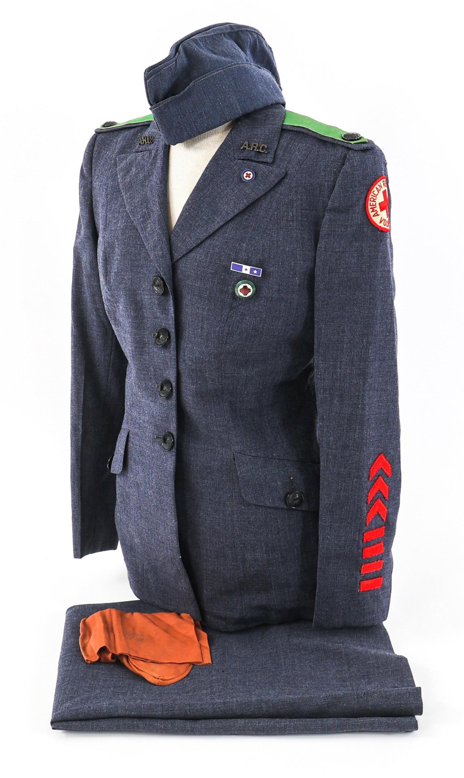WWII AMERICAN RED CROSS MOTOR SERVICE UNIFORM: WWII AMERICAN RED CROSS MOTOR SERVICE UNIFORM WWII American Red Cross Motor Service Uniform. Dark blue service dress tunic with ARC shoulder patch, green motor service shoulder boards, breast pin and 