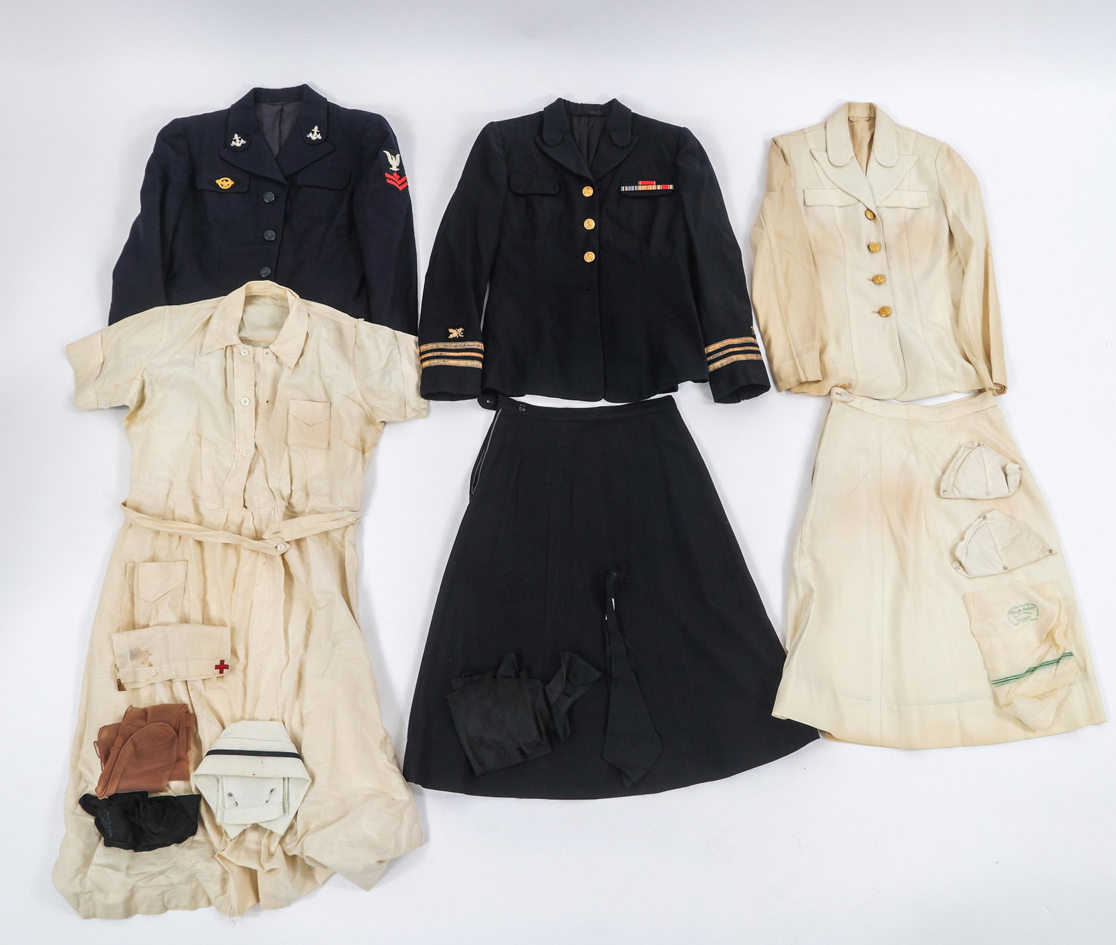 WWII US NAVY WAVES DRESS & WORK UNIFORM SETS: WWII US NAVY WAVES DRESS & WORK UNIFORM SETS Lot of 4 WWII US Navy Waves Dress & Work Uniforms. (1) US Navy WAVES Pharmacist's Mate Enlisted / NCO Uniform Set. WAVES NCO / Enlisted Service Tunic with 