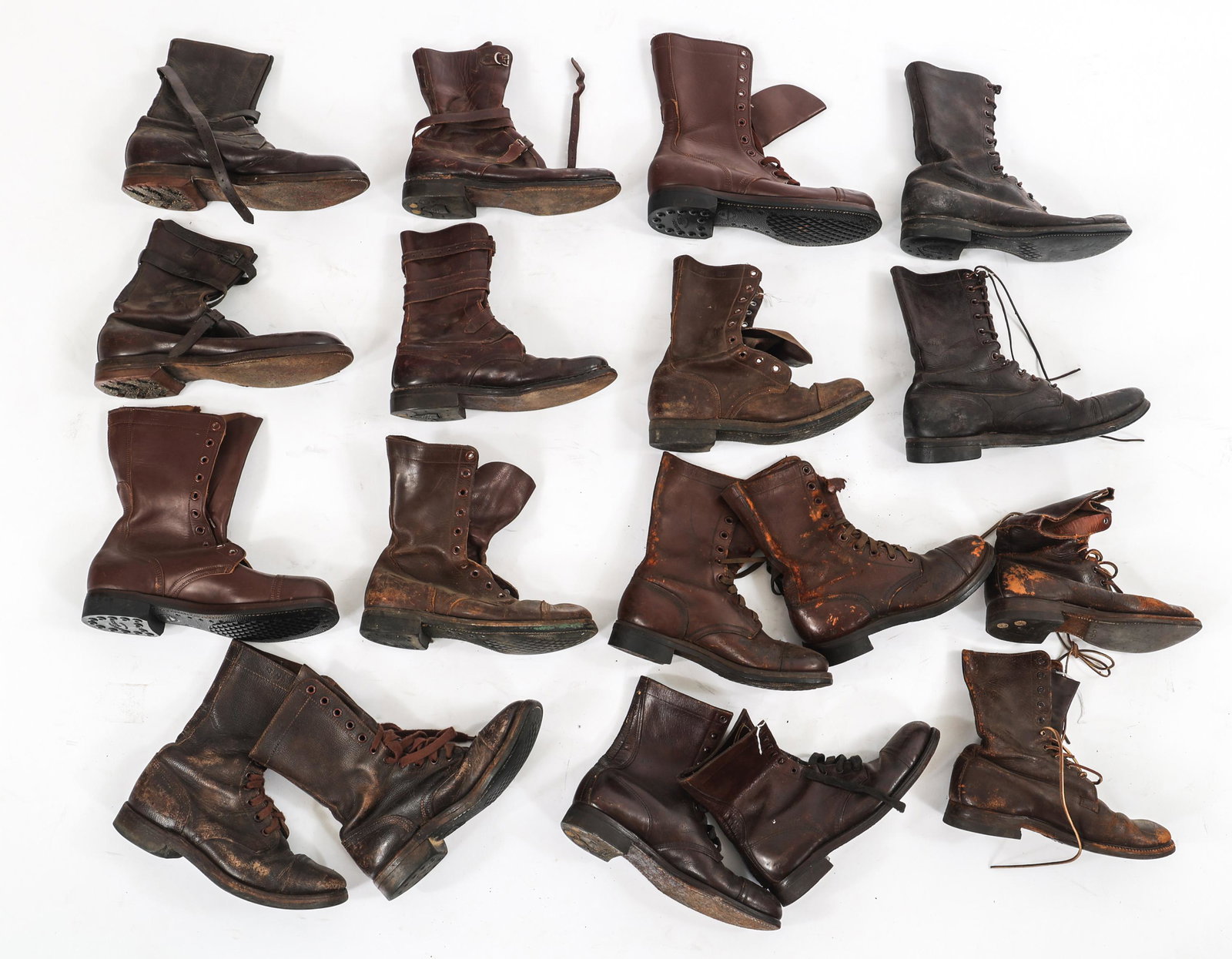 KOREA - COLD WAR US ARMY JUMP BOOTS & TANK BOOTS: KOREA - COLD WAR US ARMY JUMP BOOTS & TANK BOOTS Lot of Assorted Korea - Cold War US Army Combat and Tank Boots. (8) Pairs of brown leather jump boots. (2) Pairs of brown leather tank boots secured wi