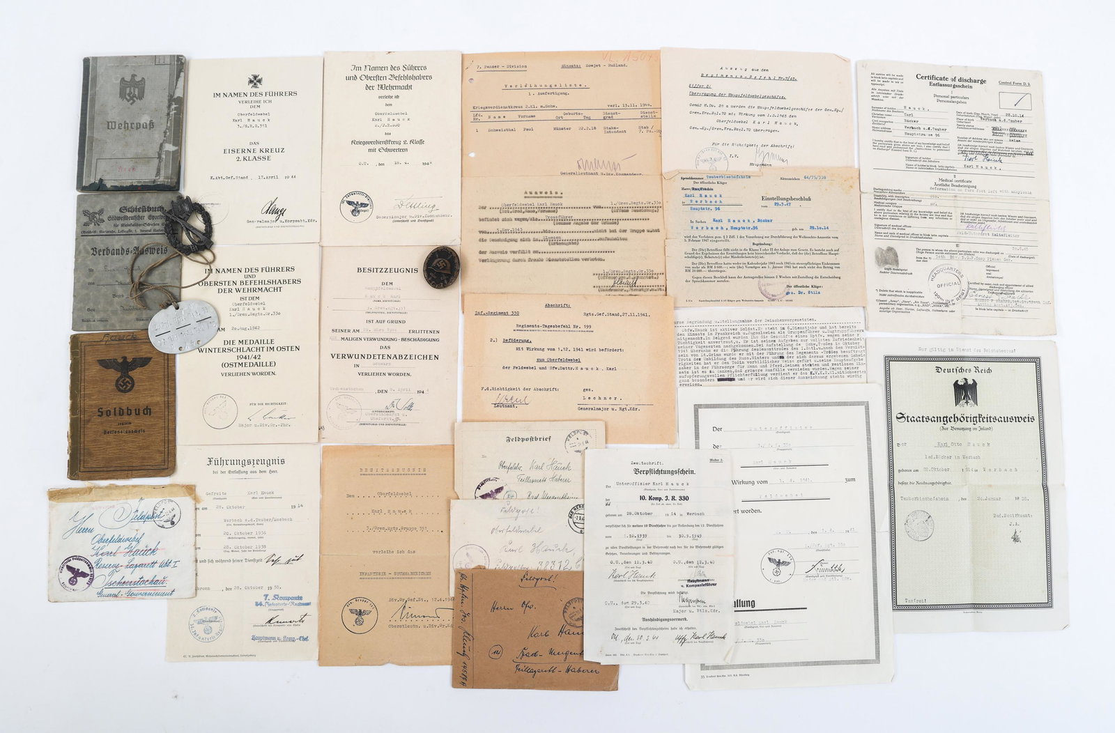 WWII GERMAN ARMY NAMED DOC & BADGE GROUPING: WWII GERMAN ARMY NAMED DOC & BADGE GROUPING WWII German Army Document and Badge Grouping. Named to Oberfeldwebel Karl Hauck who served in several different units, but discharged from the 30th Infantry