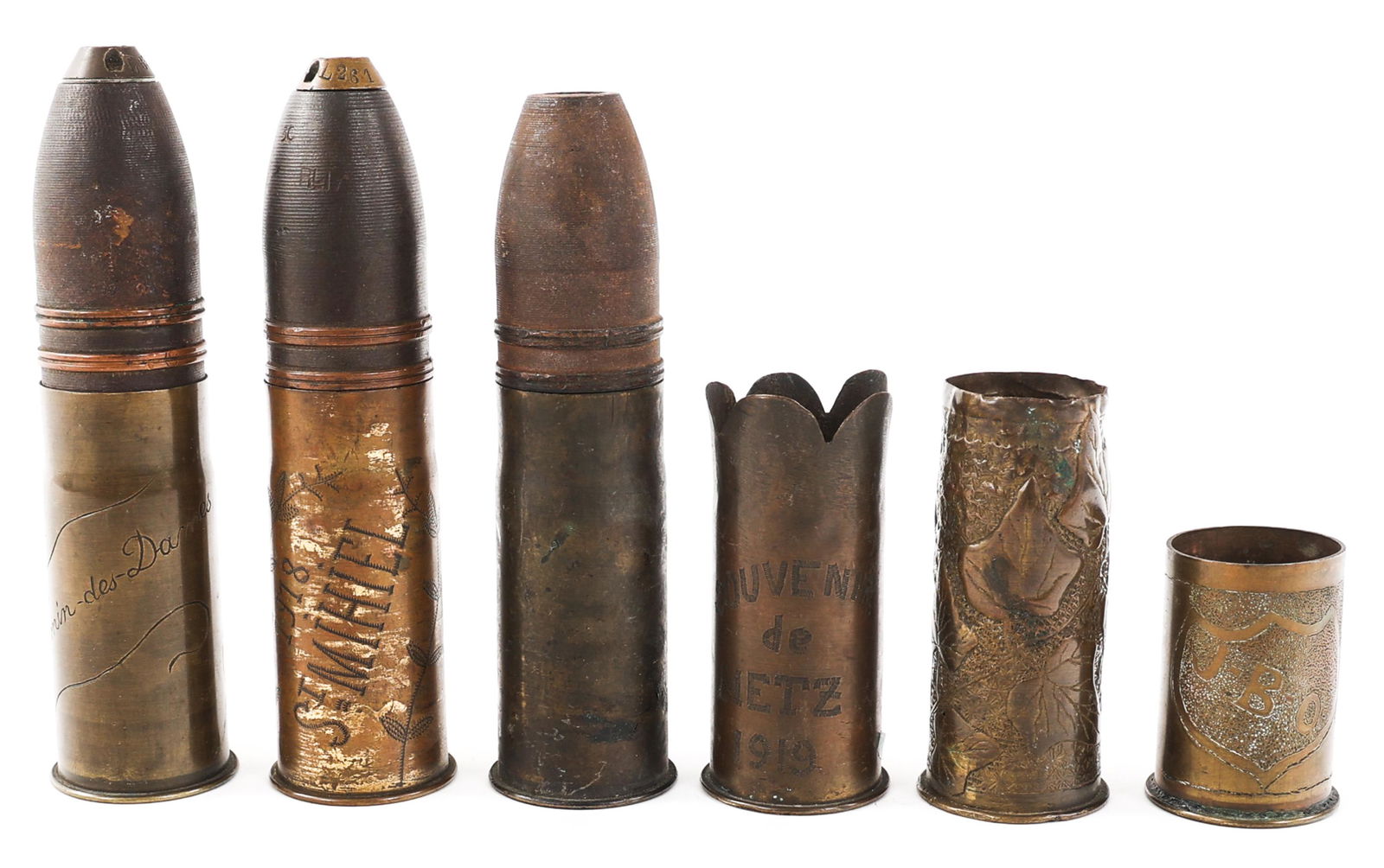 WWI ARTILLERY SHELLS TRENCH ART: WWI ARTILLERY SHELLS TRENCH ART Lot of 6. WWII French 87-35 Artillery Shell Trench Art. Ordnance Trench Art and Shells. (1) Case with "Verdun" on side. (3) Ordnance decorated shells. (1) "Souvenir de