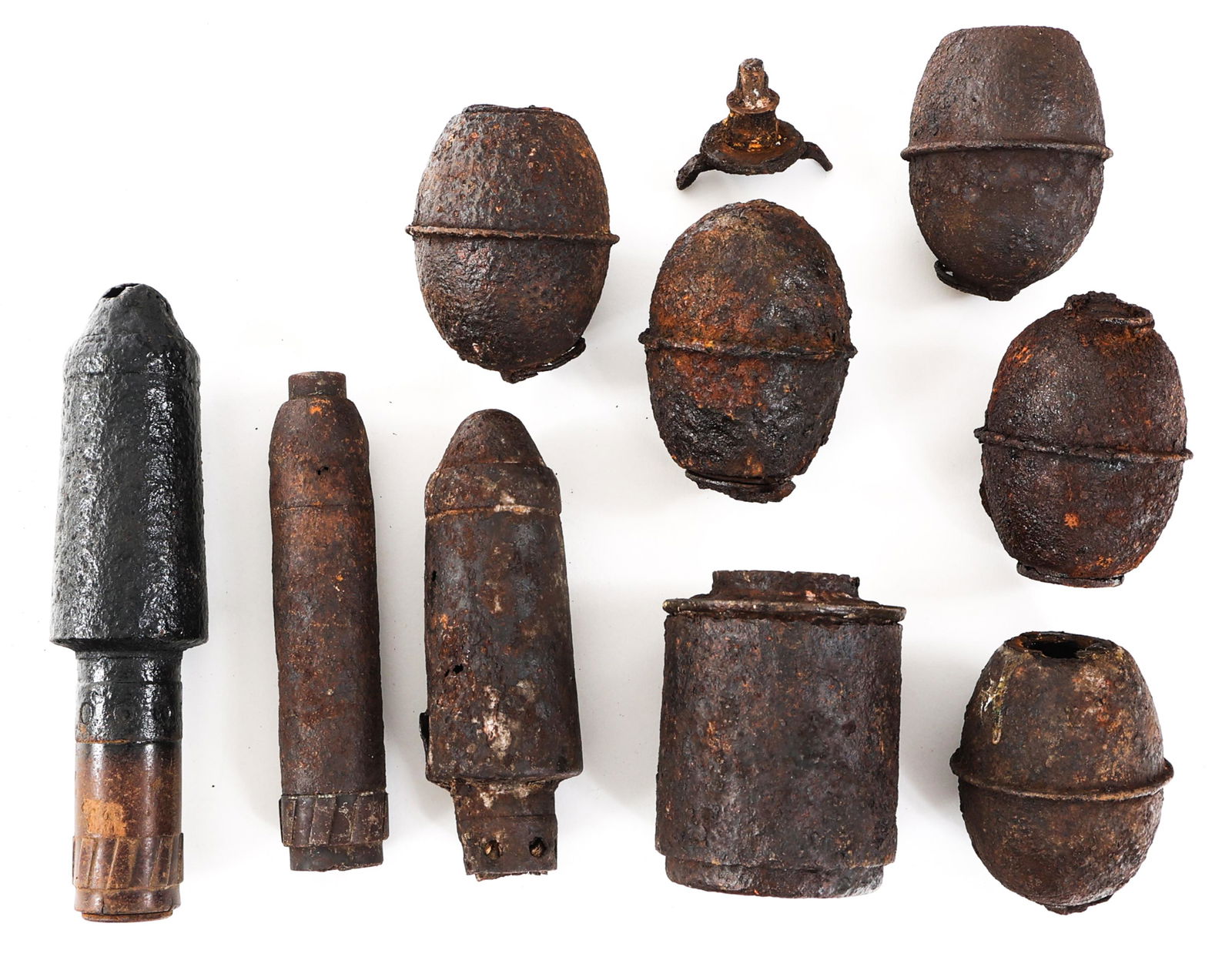 WWII GERMAN BATTLEFIELD RELIC ORDNANCE LOT OF 10: WWII GERMAN BATTLEFIELD RELIC ORDNANCE LOT OF 10 Lot of 10 WWII German Battlefield Recovered Dug Relic Ordnance. Includes M39 Egg Grenades, stick grenade head, rifle grenades, fuzes, and more. Total a