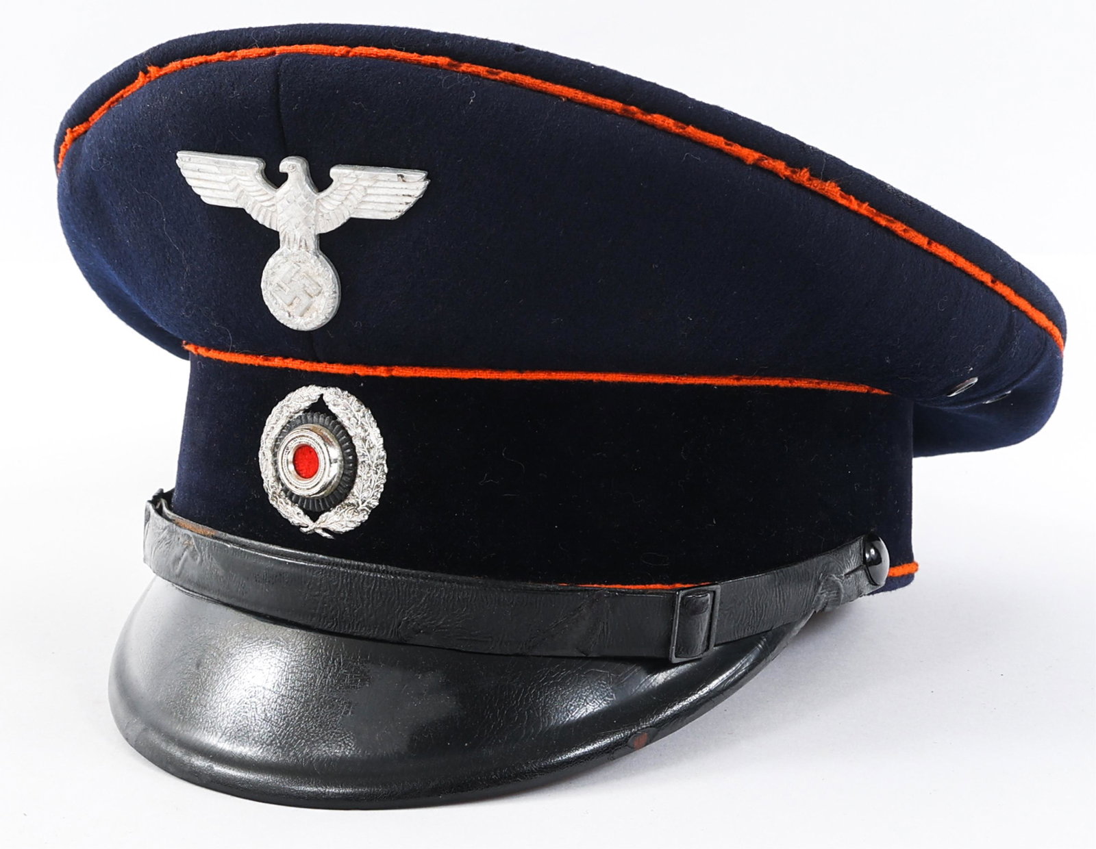 WWII GERMAN REICHSPOST VISOR CAP: WWII GERMAN REICHSPOST VISOR CAP WWII German Reichspost Visor Cap. Navy blue wool construction with bright orange piping. Manufacturer's tag by Robert Lubstein, Berlin. German eagle cap badge. Wreathe