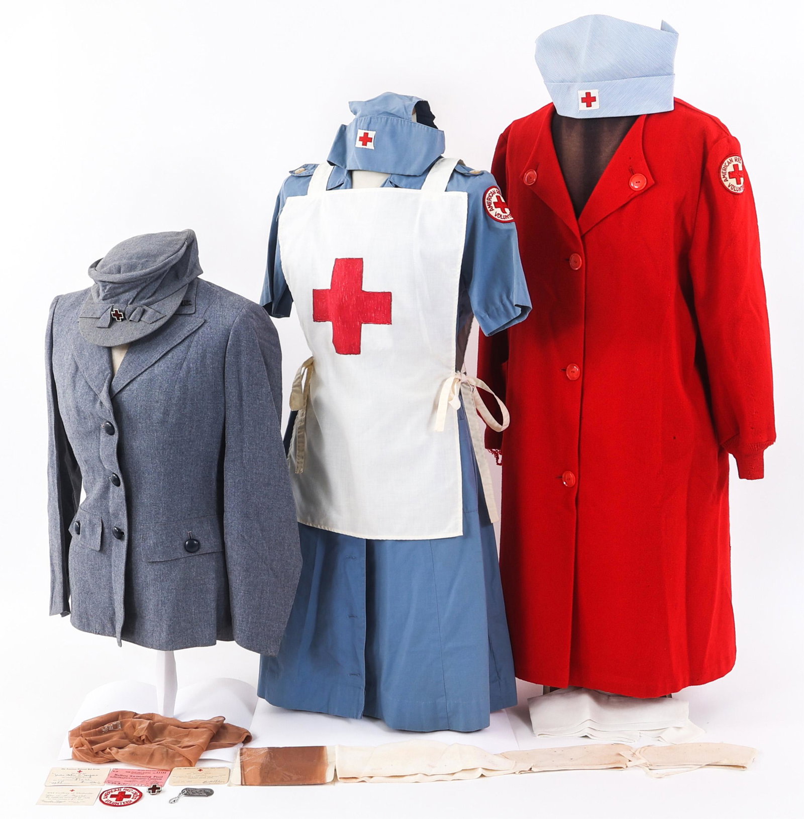 WWII AMERICAN RED CROSS VOLUNTEER FEMALE UNIFORM: WWII AMERICAN RED CROSS VOLUNTEER FEMALE UNIFORM Lot of Assorted WWII US American Red Cross Volunteer Female Uniforms. (1) ARC Winter Service Tunic with ARC collar insignia. (1) Light blue cotton ARC 