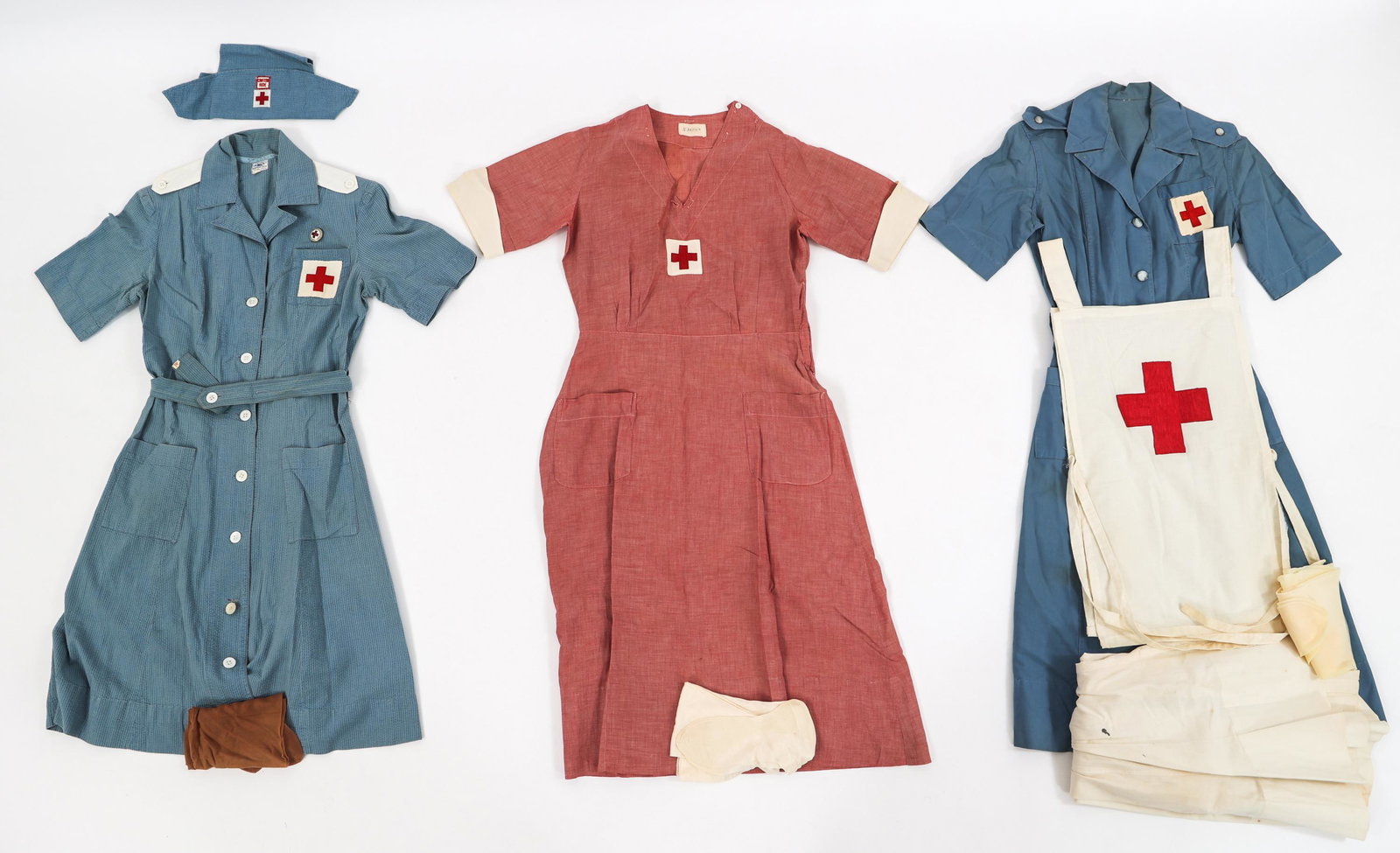 INTER WAR - WWII AMERICAN RED CROSS UNIFORMS: INTER WAR - WWII AMERICAN RED CROSS UNIFORMS Inter War - WWII American Red Cross Uniforms. (1) Canteen Aide Workers Uniform. Light blue dress with red cross chest patch. Matching coif with Canteen aid