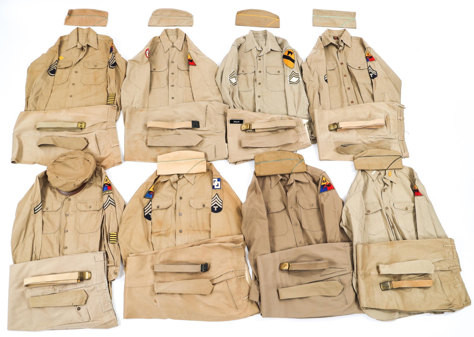 WWII - COLD WAR US ARMY SUMMER SERVICE UNIFORM LOT: WWII - COLD WAR US ARMY SUMMER SERVICE UNIFORM LOT Lot of Assorted WWII - Cold War US Army Summer Service Uniforms. Includes shirts, trousers, ties, garrison caps, visor cap, web belts, and more. Size