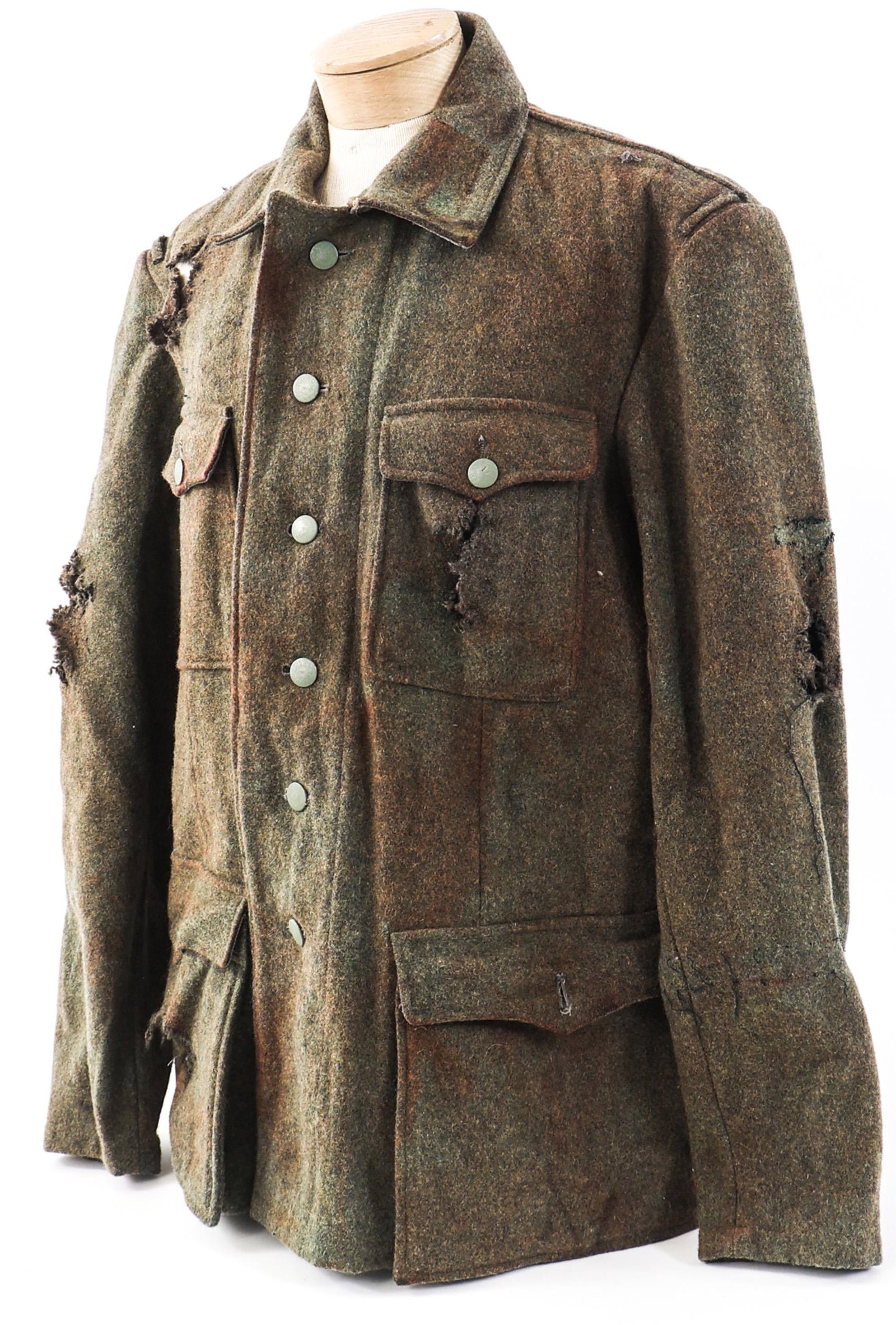 WWII GERMAN SAVING PRIVATE RYAN MOVIE PROP TUNIC: WWII GERMAN SAVING PRIVATE RYAN MOVIE PROP TUNIC WWII German Movie Prop Field Tunic. Olive green, wool construction. Marked to "Jindrich Klaus" under left armpit - Stunt man in "Saving Private Ryan".