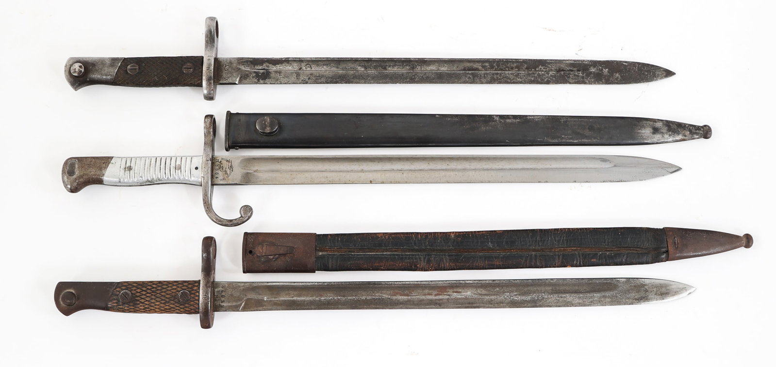 19th C. WORLD MILITARY BAYONET LOT OF 3: 19th C. WORLD MILITARY BAYONET LOT OF 3 Lot of 3 WWII 19th Century Military Bayonets. (1) Argentinian M1891 Bayonet. Bright, single edged blade with fuller. Inspection stamp on spine. Maker marked by 