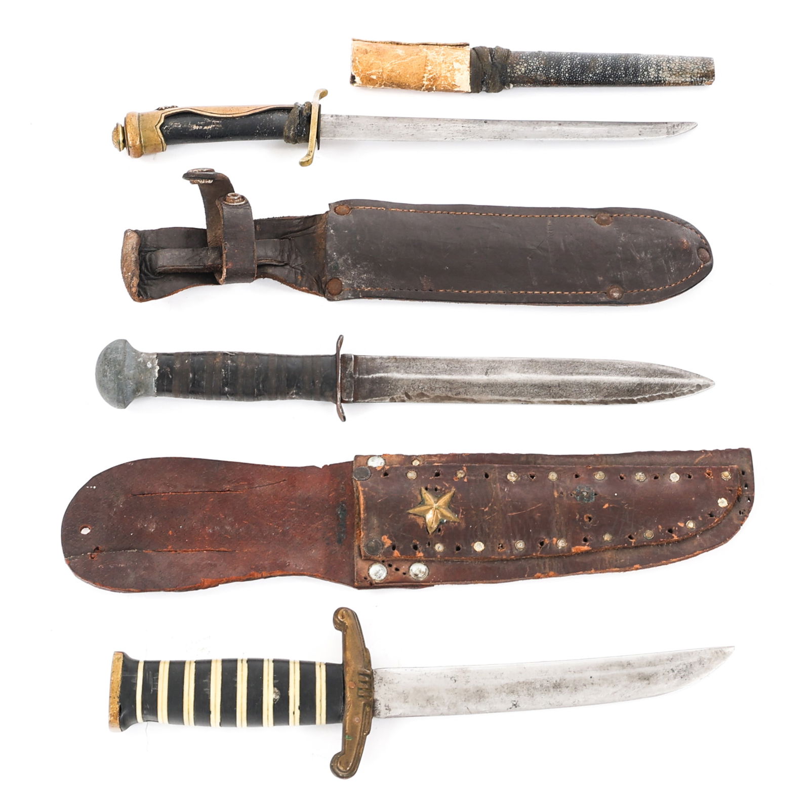 19th C. - WWII THEATER MADE KNIFE LOT OF 3: 19th C. - WWII THEATER MADE KNIFE LOT OF 3 Lot of 3 19th Century - WWII Theater Made Knives. (1) Fighting Knife. Double edged blade. No visible maker marks. Steel crossguard. Stacked leather handle wi