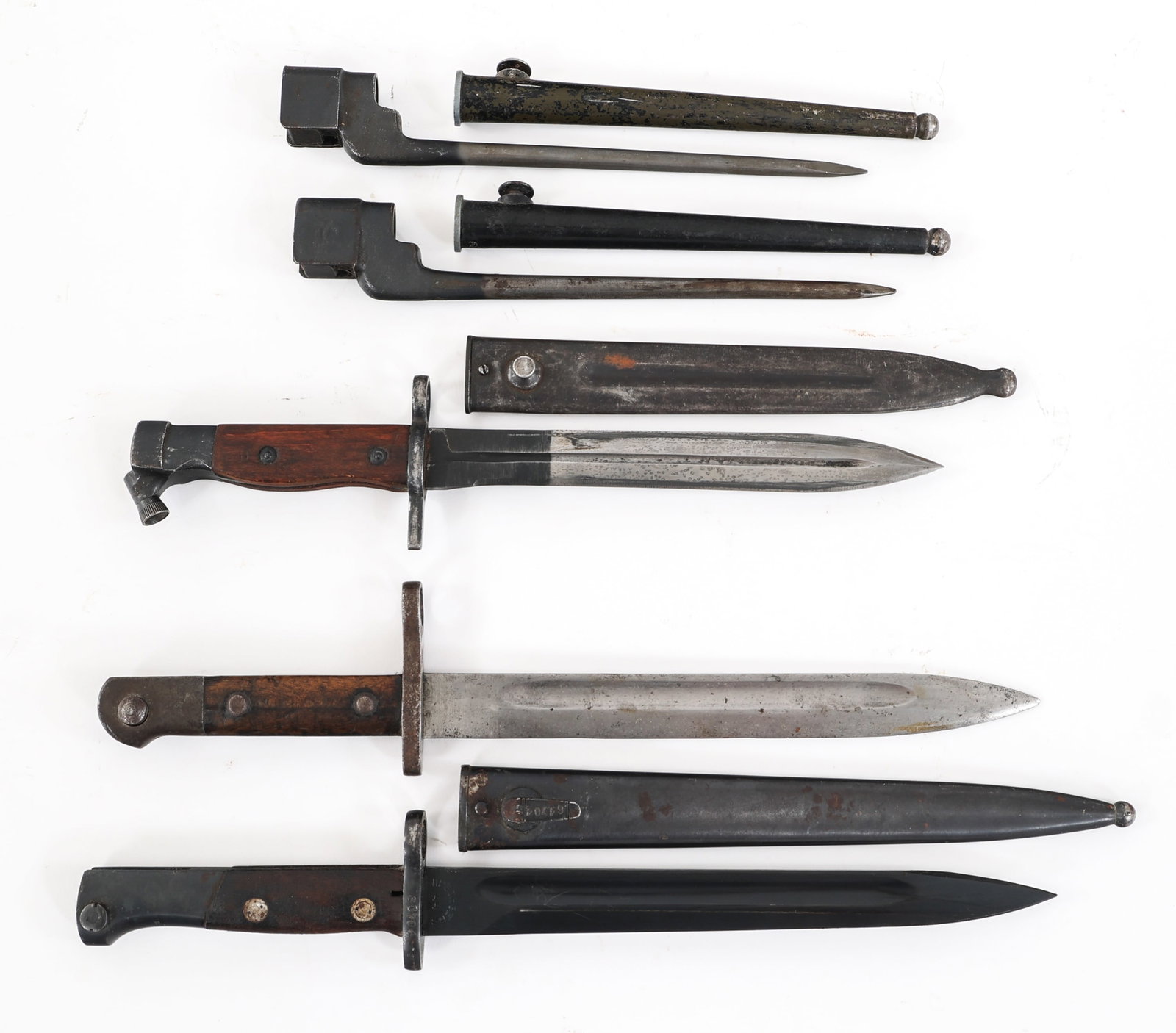 WWII - COLD WAR WORLD MILITARY BAYONET LOT OF 4: WWII - COLD WAR WORLD MILITARY BAYONET LOT OF 4 Lot of 4 WWII - Cold War World Military Bayonets. (1) Turkish M1935. Single edged, bright blade with fuller. No visible maker marks. Steel hilt with woo