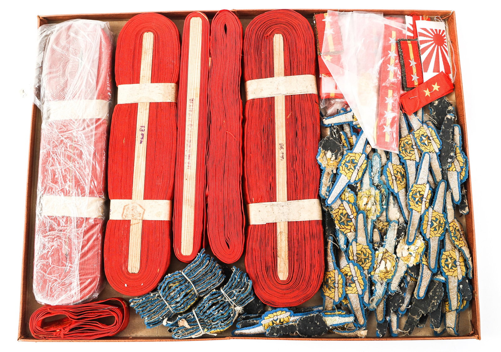 WWII IMPERIAL JAPANESE UNCUT ROLL OF INSIGNIA: WWII IMPERIAL JAPANESE UNCUT ROLL OF INSIGNIA Lot of Framed WWII Imperial Japanese Insignia. Includes bullion Pilot Wing patches, uncut rolls of NCO collar insignia, cut NCO collar insignia, and more.