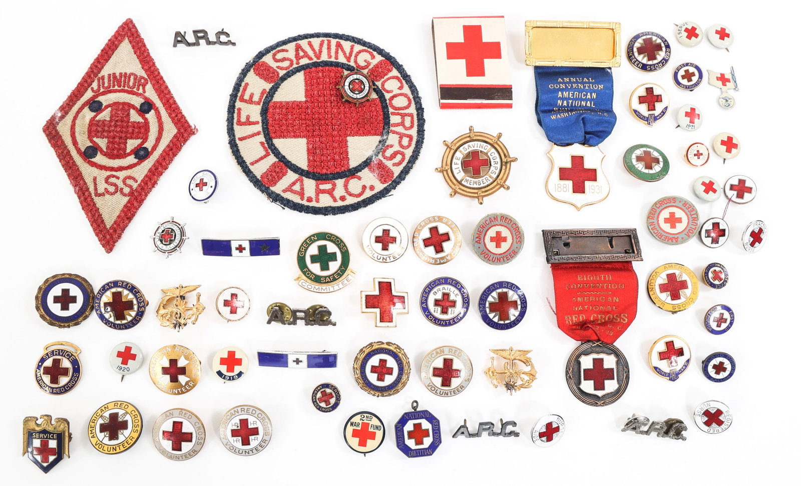 WWI - WWII AMERICAN RED CROSS INSIGNIA LOT: WWI - WWII AMERICAN RED CROSS INSIGNIA LOT Approximately 60 WWI - WWII American Red Cross Patches, Pins, Ribbons, and more.