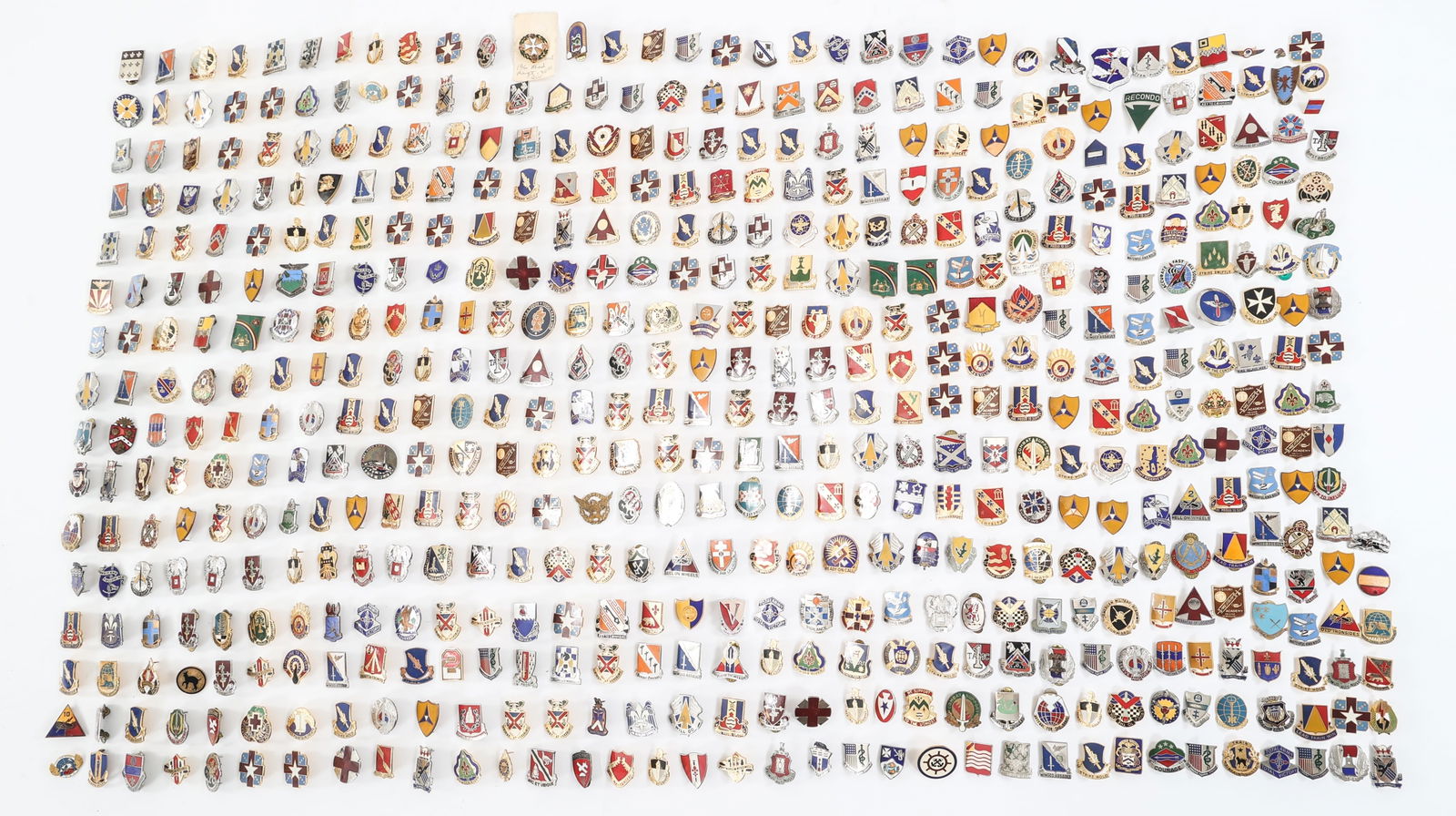 COLD WAR - CURRENT US ARMED FORCES DUI PINS LOT: COLD WAR - CURRENT US ARMED FORCES DUI PINS LOT Approximately 10 lbs of Cold War - Current US Armed Forces DUI Pins. Assorted units and makers.