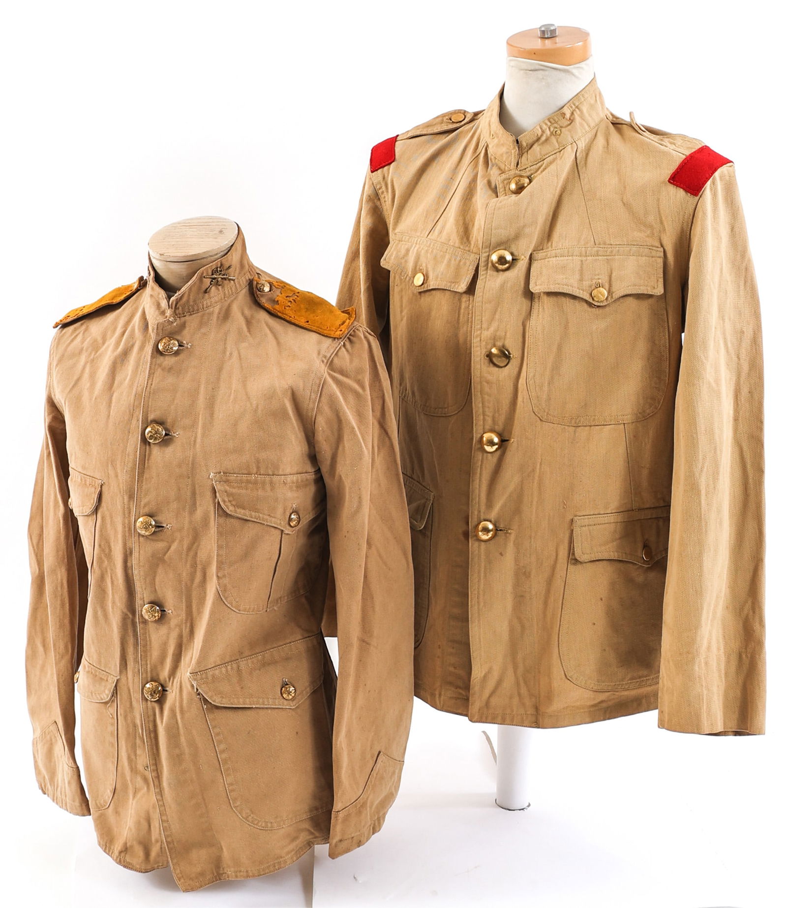 SPAN-AM US ARMY SUMMER SERVICE TUNIC LOT OF 2: SPAN-AM US ARMY SUMMER SERVICE TUNIC LOT OF 2 Lot of 2 Spanish American War US Army Summer Service Tunics. (1) Khaki cotton construction. Brass US Army buttons. Yellow felt shoulder boards and musicia